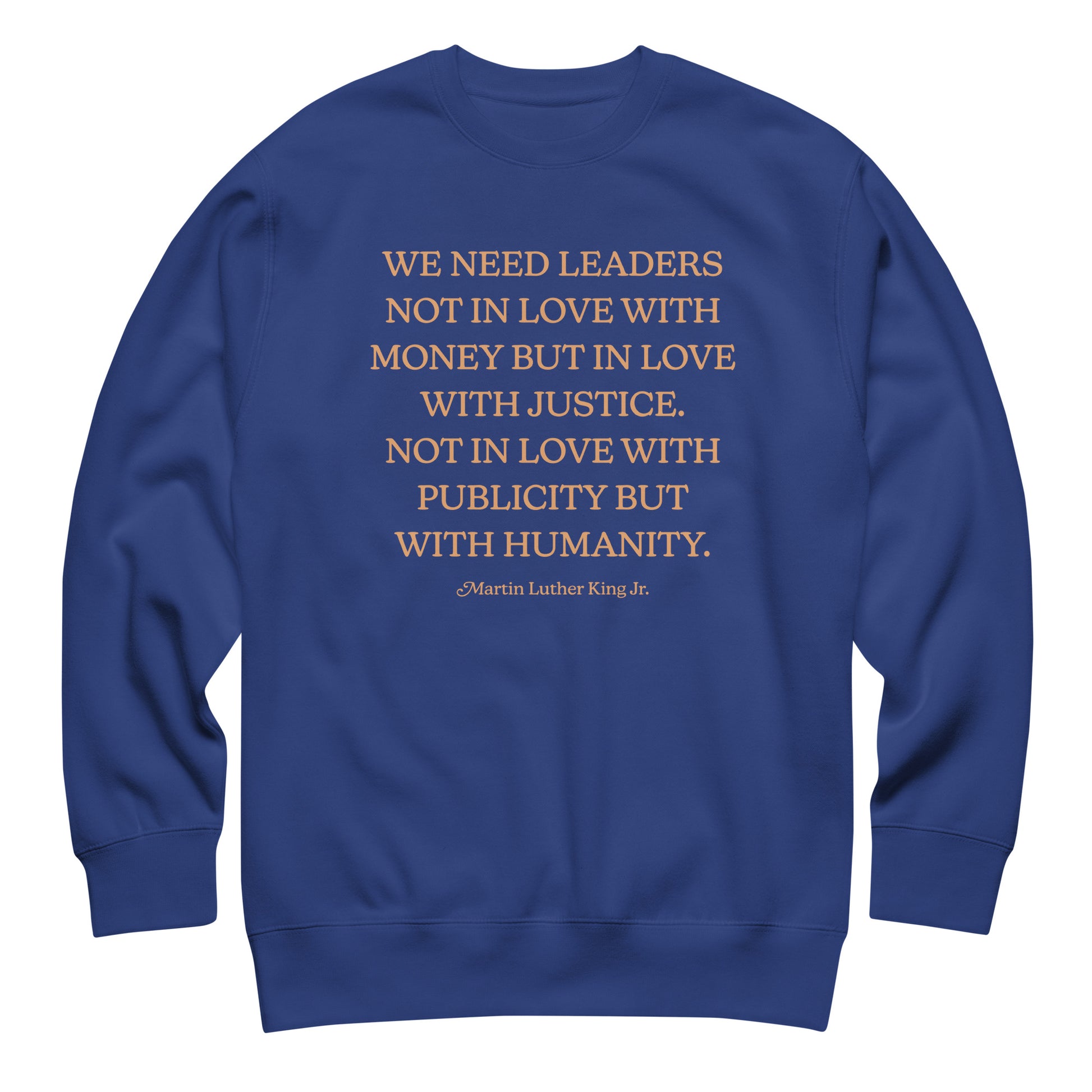 Royal blue unisex premium sweatshirt showing the full MLK quote about justice, humanity, and moral responsibility. Clean design with balanced typography.