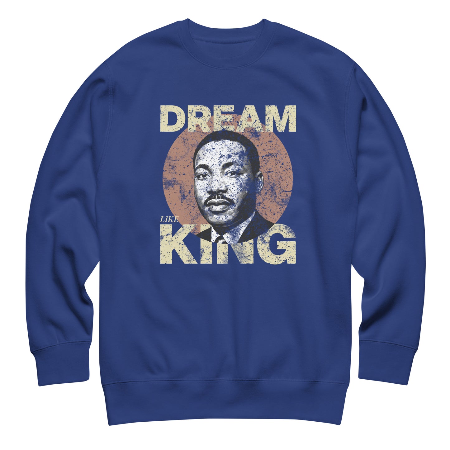 Royal blue unisex premium sweatshirt featuring “DREAM LIKE KING” with MLK’s portrait inside a distressed circle. Vintage civil-rights artwork from Blue Wave USA.