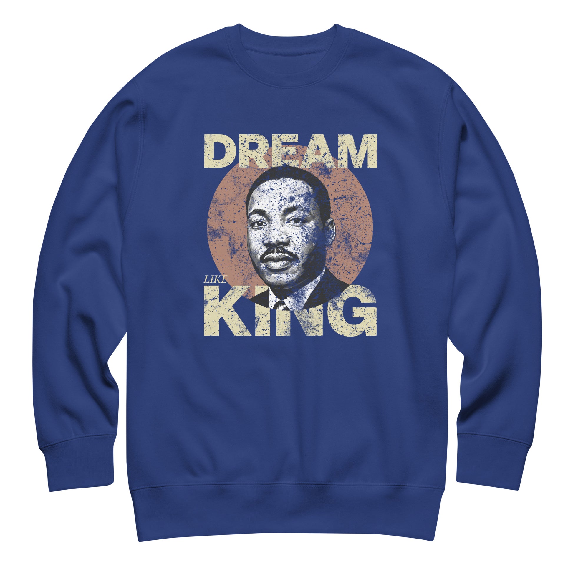 Royal blue unisex premium sweatshirt featuring “DREAM LIKE KING” with MLK’s portrait inside a distressed circle. Vintage civil-rights artwork from Blue Wave USA.
