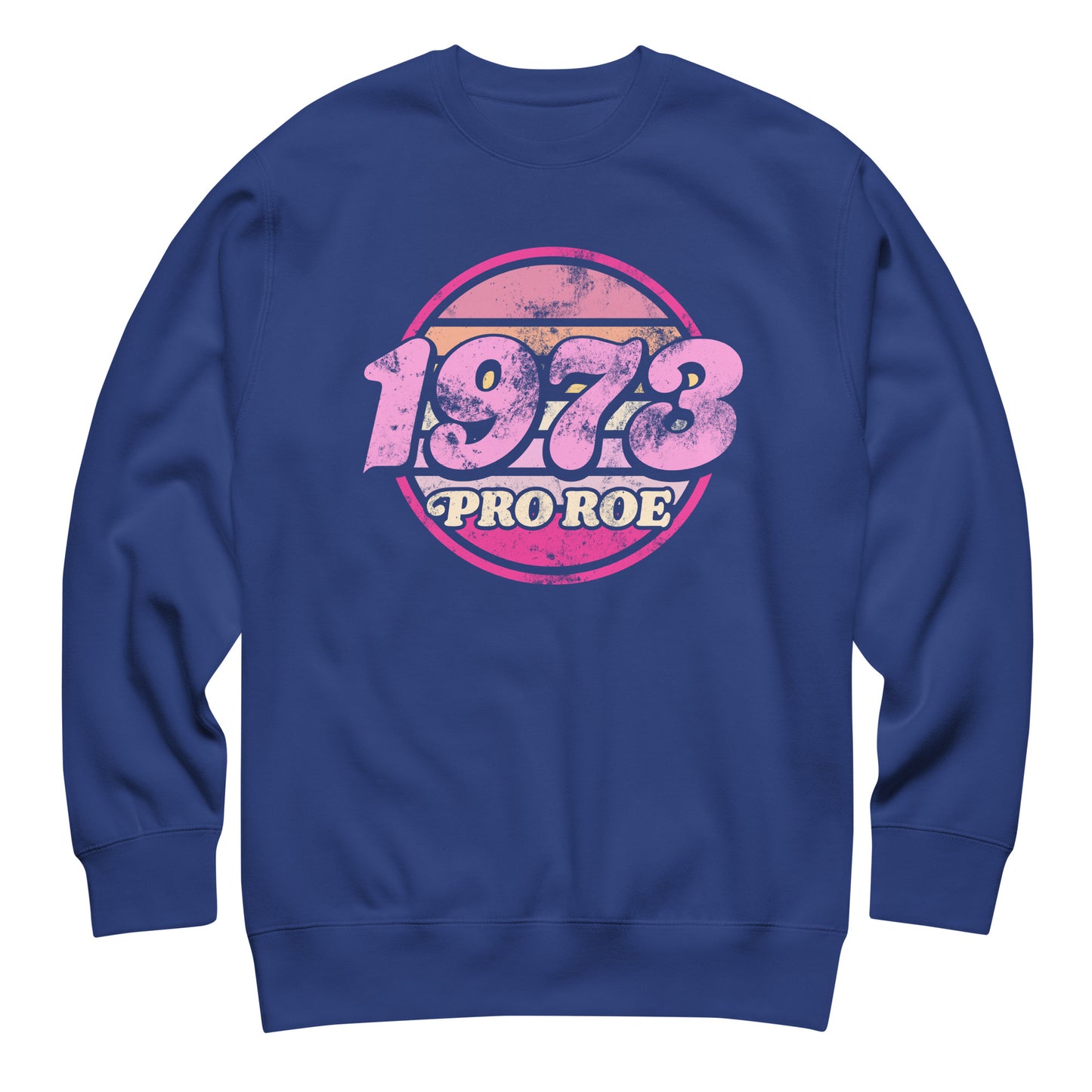 Royal blue unisex premium sweatshirt featuring a distressed circular badge reading “1973 PRO ROE,” vintage typography centered on smooth blue fleece fabric.