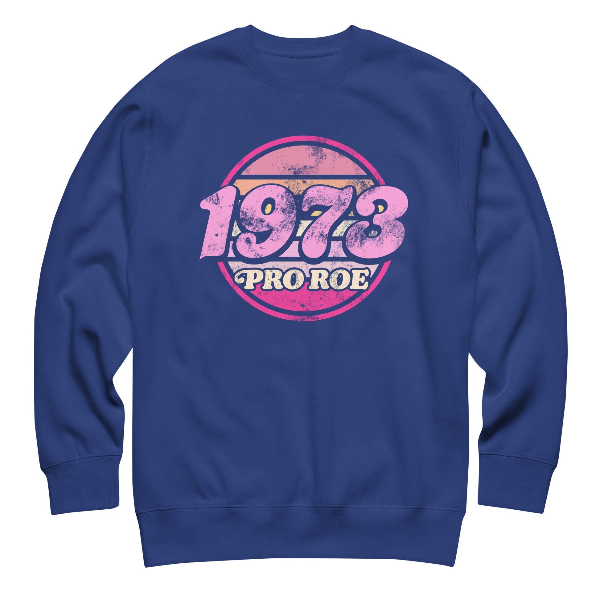 Royal blue unisex premium sweatshirt featuring a distressed circular badge reading “1973 PRO ROE,” vintage typography centered on smooth blue fleece fabric.