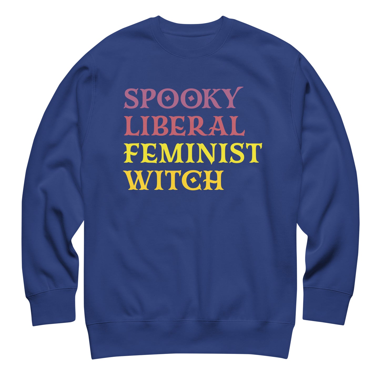 Royal blue unisex premium sweatshirt featuring stacked retro block lettering in pink, yellow, and purple tones, clean centered composition, printed message “SPOOKY LIBERAL FEMINIST WITCH.”