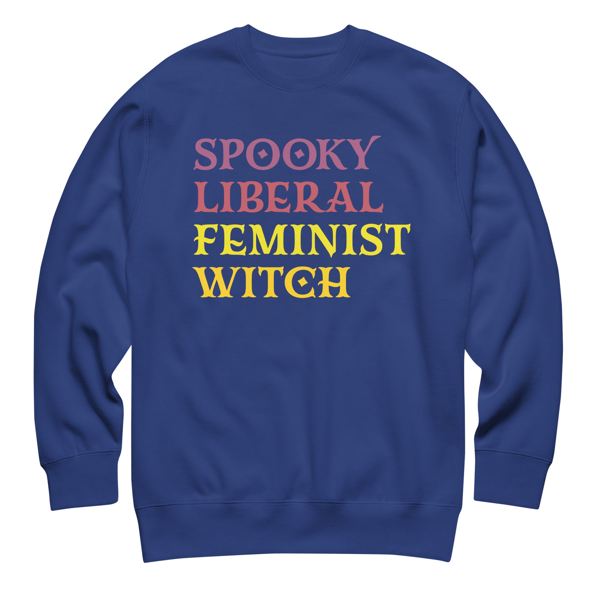 Royal blue unisex premium sweatshirt featuring stacked retro block lettering in pink, yellow, and purple tones, clean centered composition, printed message “SPOOKY LIBERAL FEMINIST WITCH.”