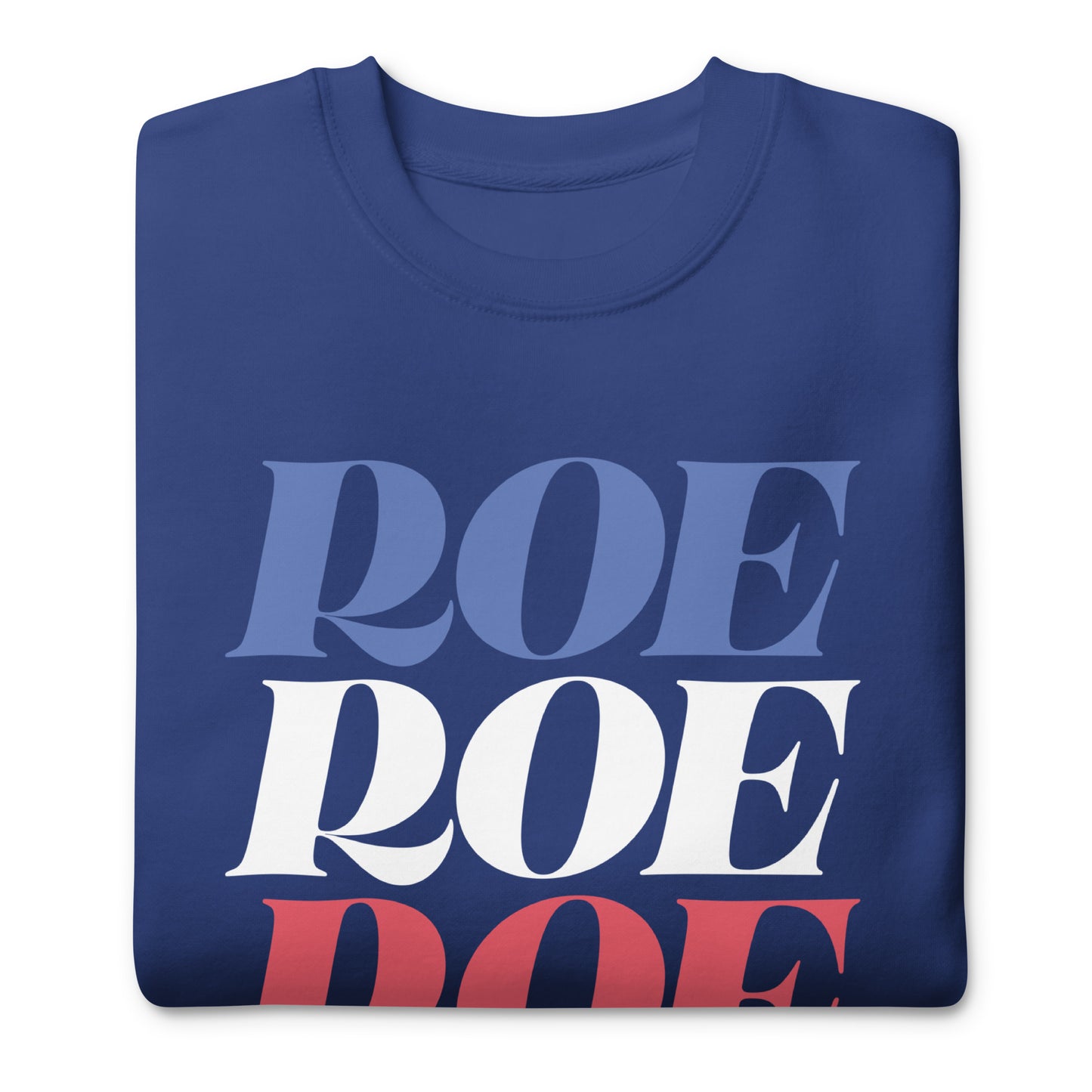 Folded royal blue unisex premium sweatshirt featuring stacked patriotic typography reading “Roe Roe Roe Your Vote,” pro-choice activist sweatshirt.