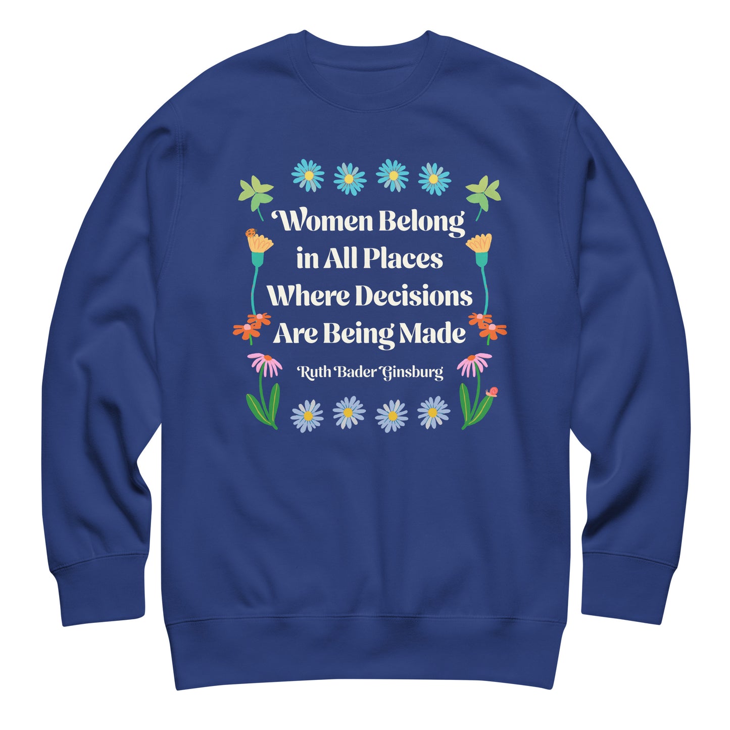 Blue sweatshirt displaying Ruth Bader Ginsburg quote with colorful flowers and feminist typography promoting women in leadership roles.