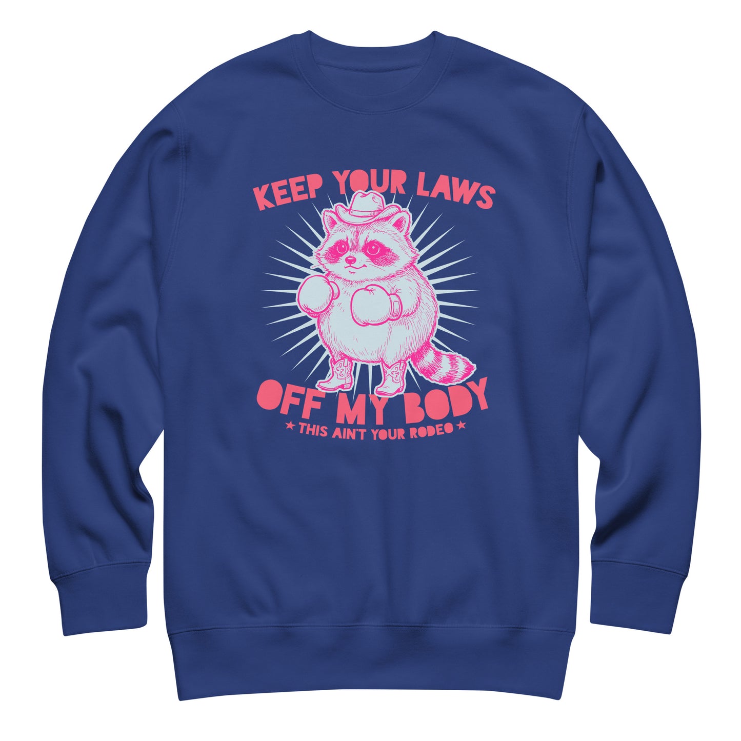 Blue Wave USA royal blue sweatshirt displaying pink raccoon illustration with western protest slogan in justice-focused activist style.
