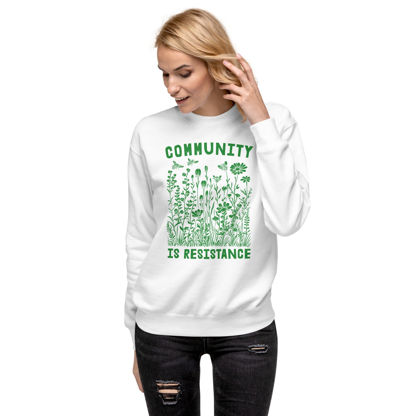 Model wearing white unisex premium sweatshirt featuring wildflower illustration and vintage typography, progressive social justice sweatshirt from Blue Wave USA.