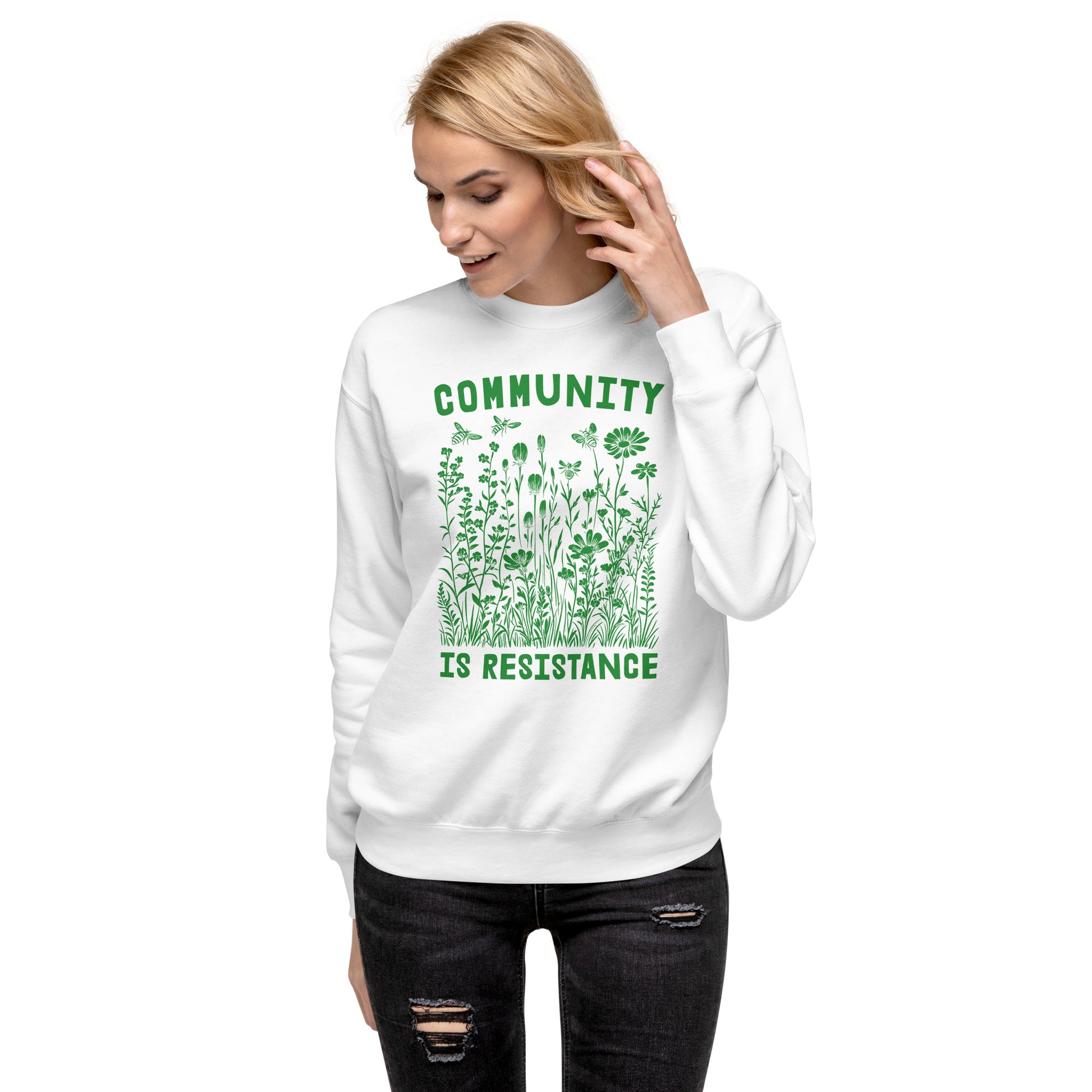Model wearing white unisex premium sweatshirt featuring wildflower illustration and vintage typography, progressive social justice sweatshirt from Blue Wave USA.