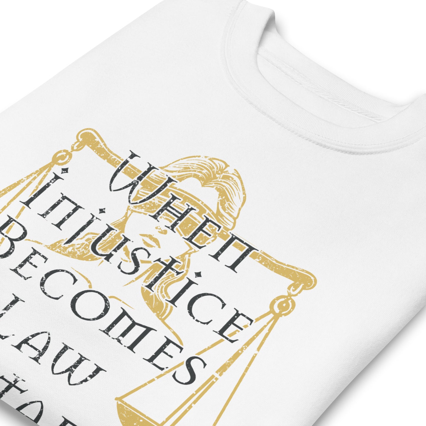 Close-up of white unisex premium sweatshirt showing Lady Justice scales illustration and gold serif typography, progressive justice apparel from Blue Wave USA.