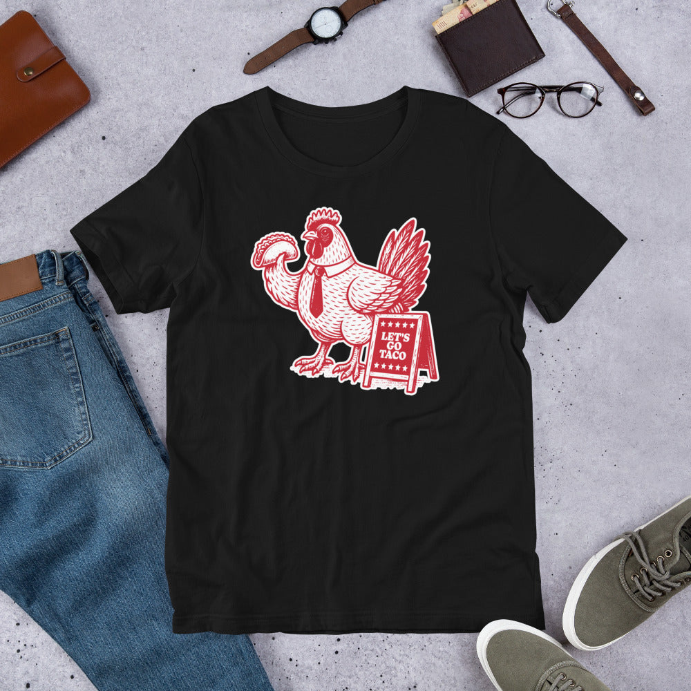Flat Lay Image: Flat Lay of Let’s Go TACO Shirt – Anti-Trump Graphic Tee