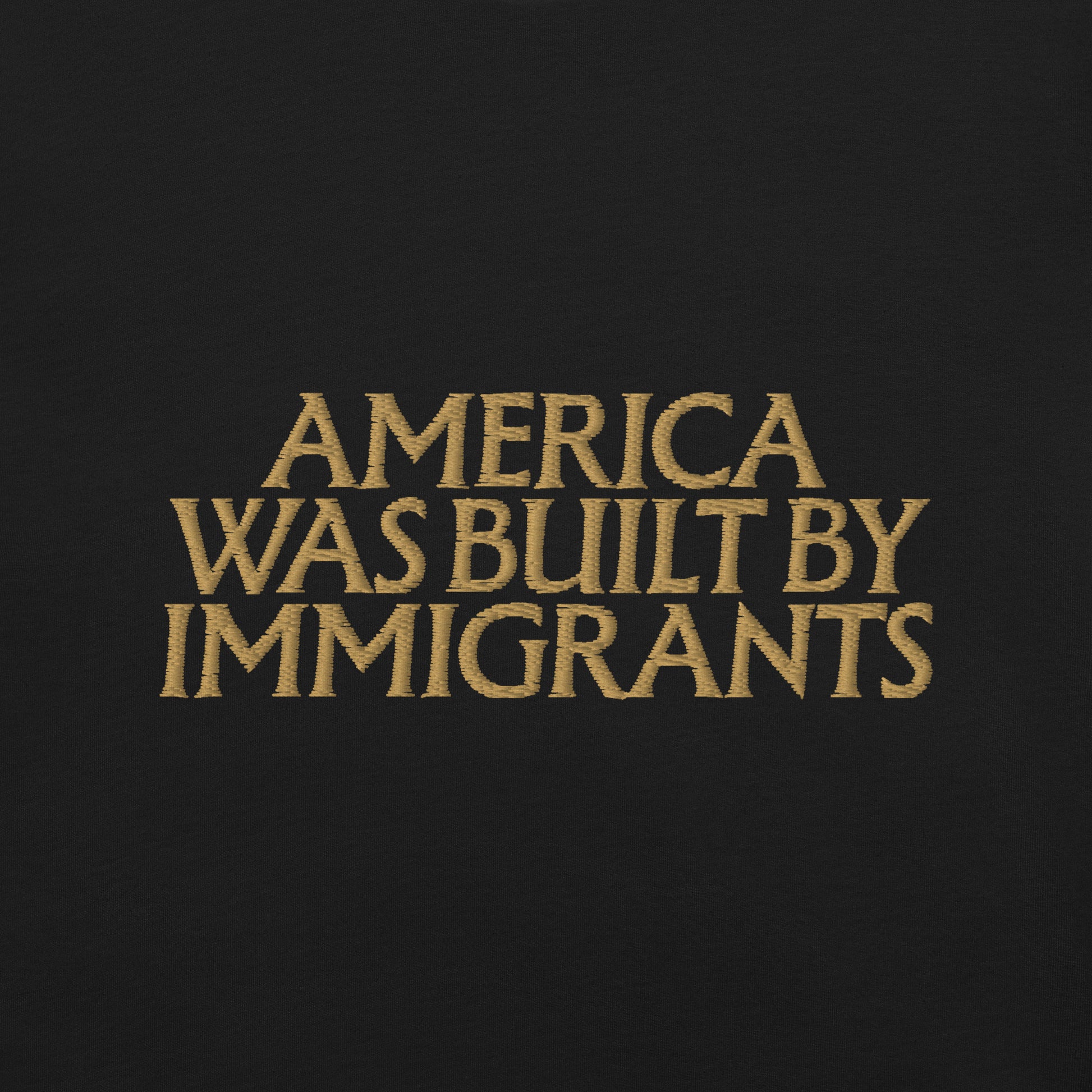 Close up detaied view of the "America Was Built By Immigrants" Pro-Immigrant Embroidered Unisex T-Shirt