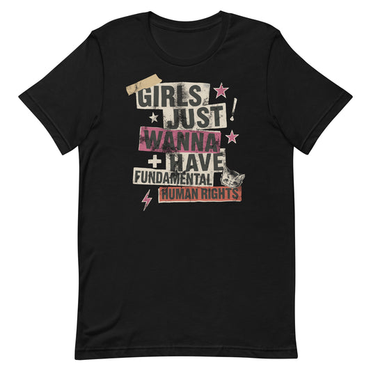 Black unisex t-shirt featuring punk-style collage text that reads “Girls Just Wanna Have Fundamental Human Rights” with stars, tape textures, and lightning bolts. Feminist grunge design with bold energy.