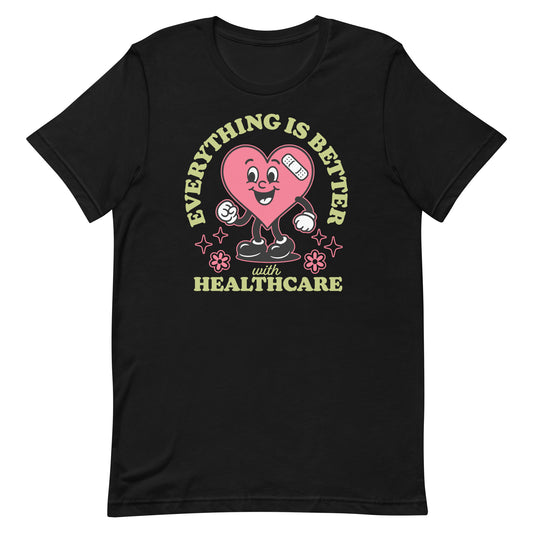 Black unisex t-shirt with a cheerful pink heart cartoon holding medical tools and the text “Everything Is Better with Healthcare.”