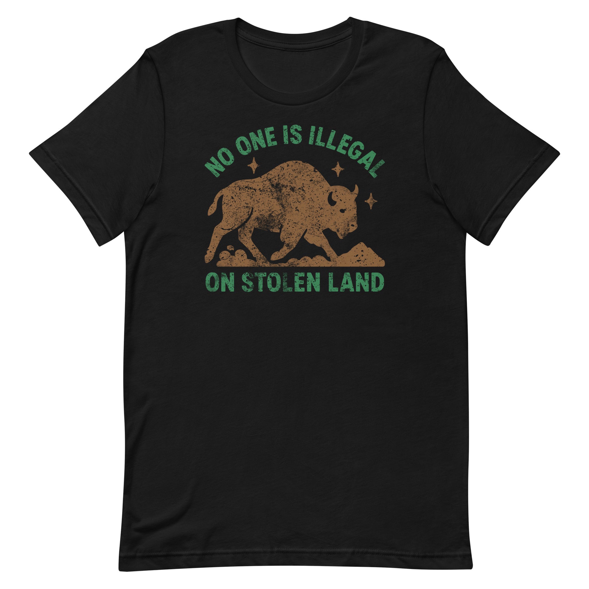 Black unisex t-shirt featuring an earthy buffalo silhouette with stars and the message “NO ONE IS ILLEGAL ON STOLEN LAND,” a bold Indigenous rights design in muted brown and green tones.