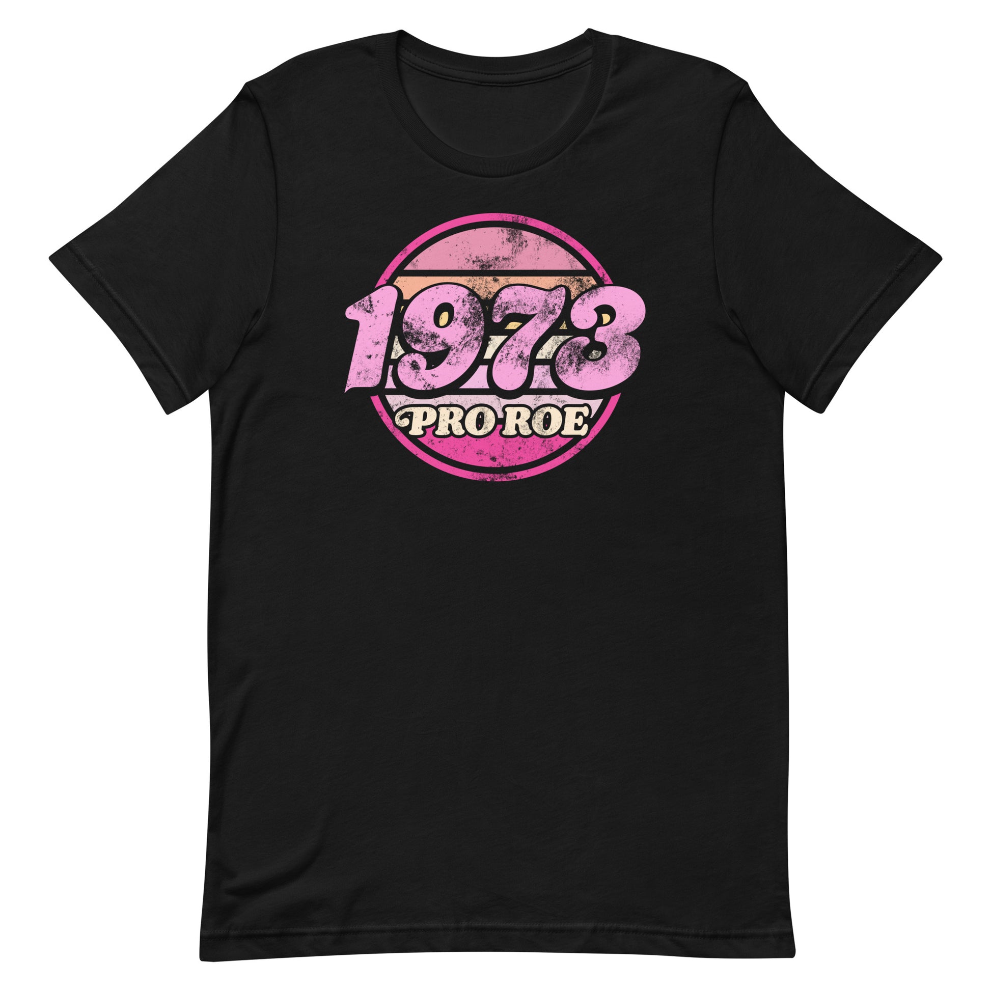 Black unisex t-shirt featuring a distressed retro circular badge design in pink and cream reading “1973 PRO ROE,” vintage protest graphic centered on a solid black garment.