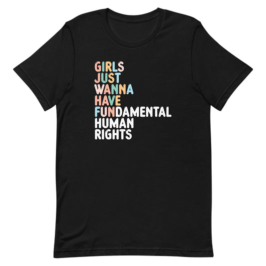 Black unisex t-shirt featuring stacked retro typography reading “GIRLS JUST WANNA HAVE FUNDAMENTAL HUMAN RIGHTS,” feminist activist apparel from Blue Wave USA.
