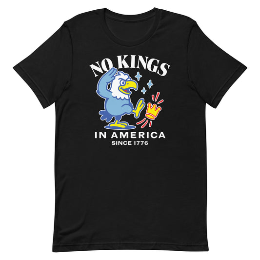Black unisex t-shirt featuring cartoon eagle graphic with crown crossed out and the phrase “NO KINGS IN AMERICA SINCE 1776.”