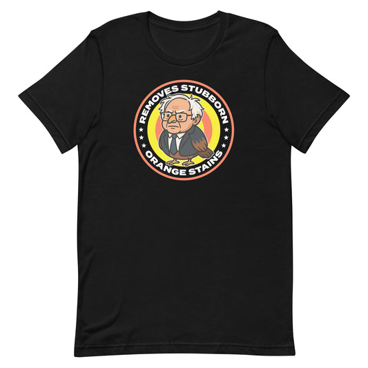 Unisex black T-shirt featuring Birdie Sanders parody detergent badge with “Removes Stubborn Orange Stains” text, playful political humor graphic for progressive apparel.