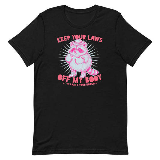 Unisex black T-shirt featuring pink cowboy raccoon with “Keep Your Laws Off My Body” text, bold feminist protest graphic for reproductive rights apparel.