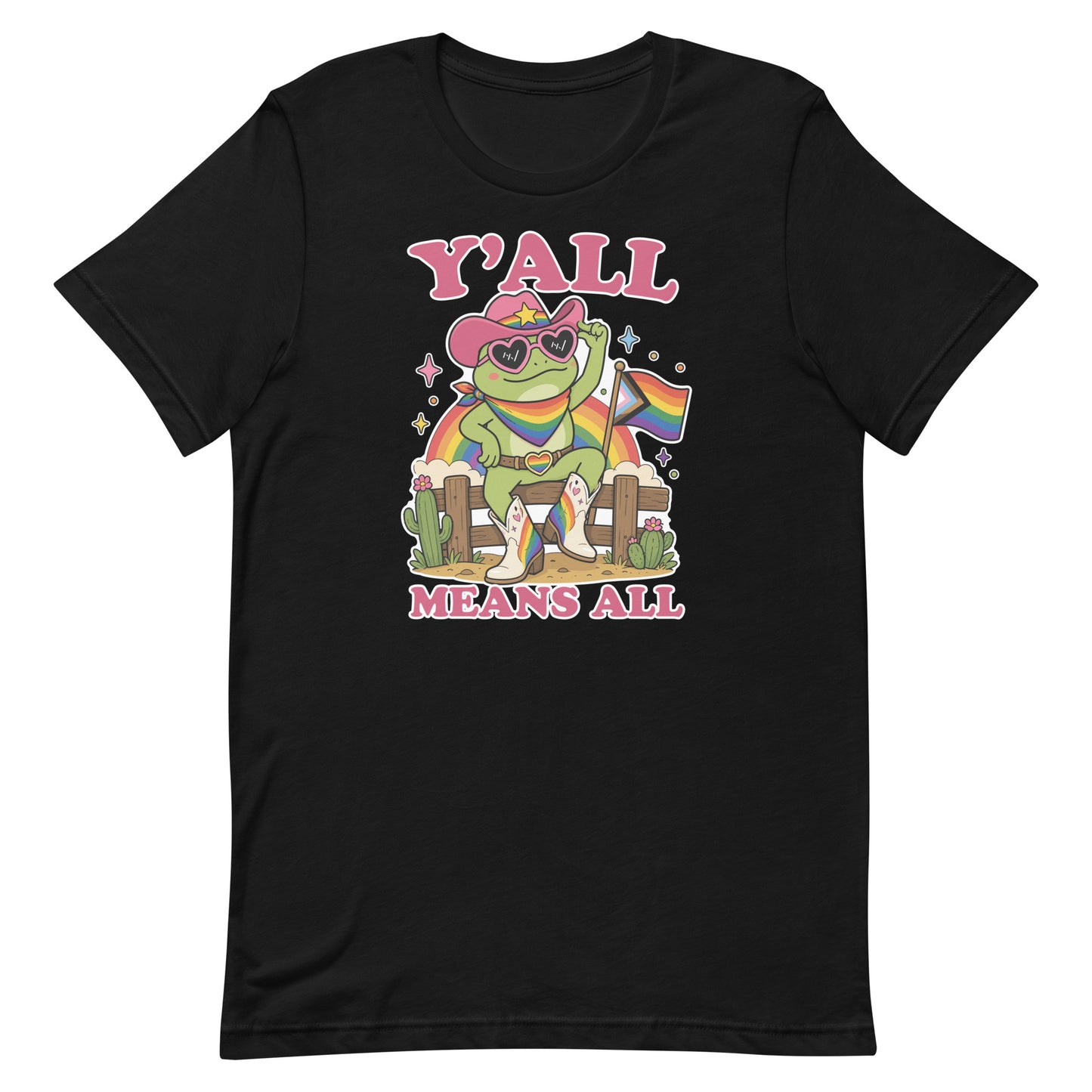 Black unisex pride t-shirt featuring a rainbow cowboy frog in heart-shaped sunglasses holding a pride flag with bold “Y’All Means All” message celebrating LGBTQ+ inclusion.