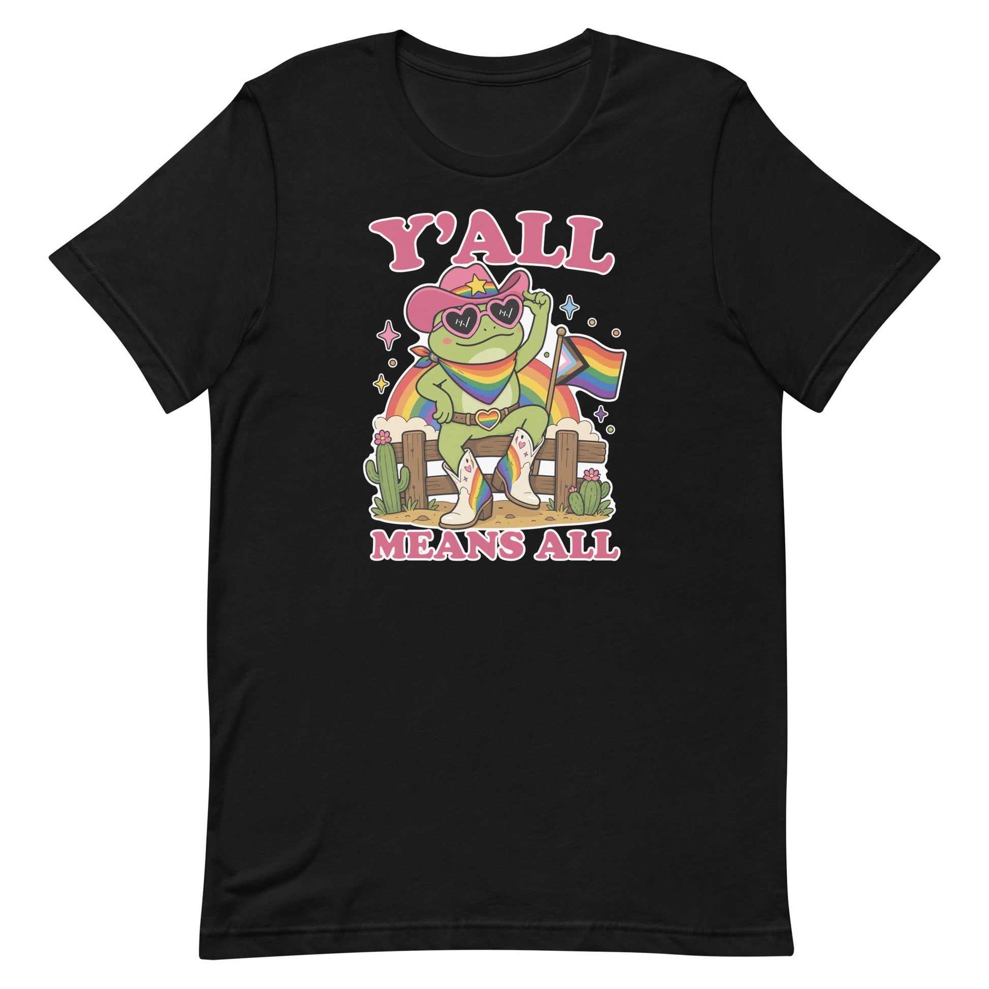 Black unisex pride t-shirt featuring a rainbow cowboy frog in heart-shaped sunglasses holding a pride flag with bold “Y’All Means All” message celebrating LGBTQ+ inclusion.