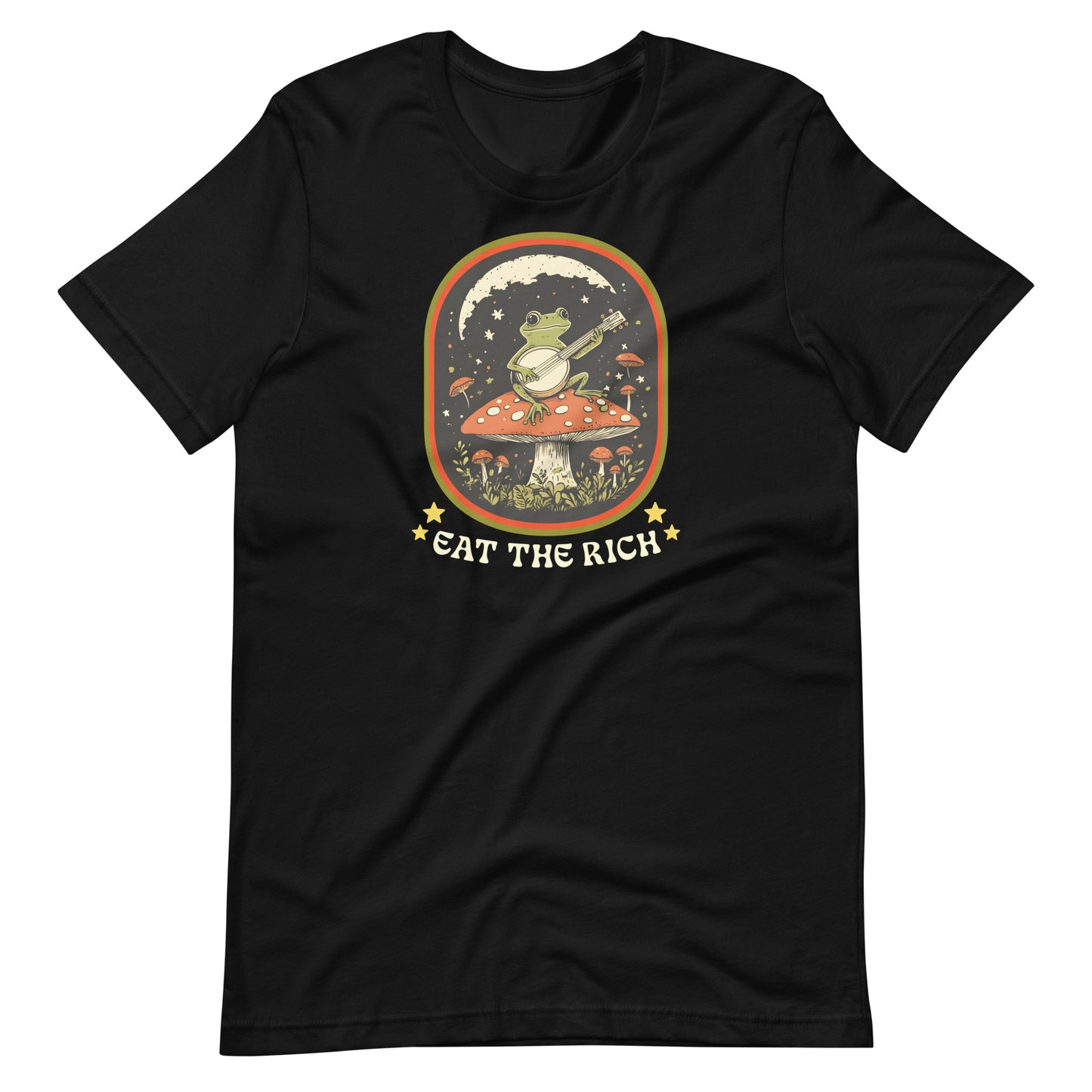Black anti-capitalism t-shirt featuring a banjo-playing frog surrounded by stars and vintage-inspired artwork with the phrase “Eat The Rich.”