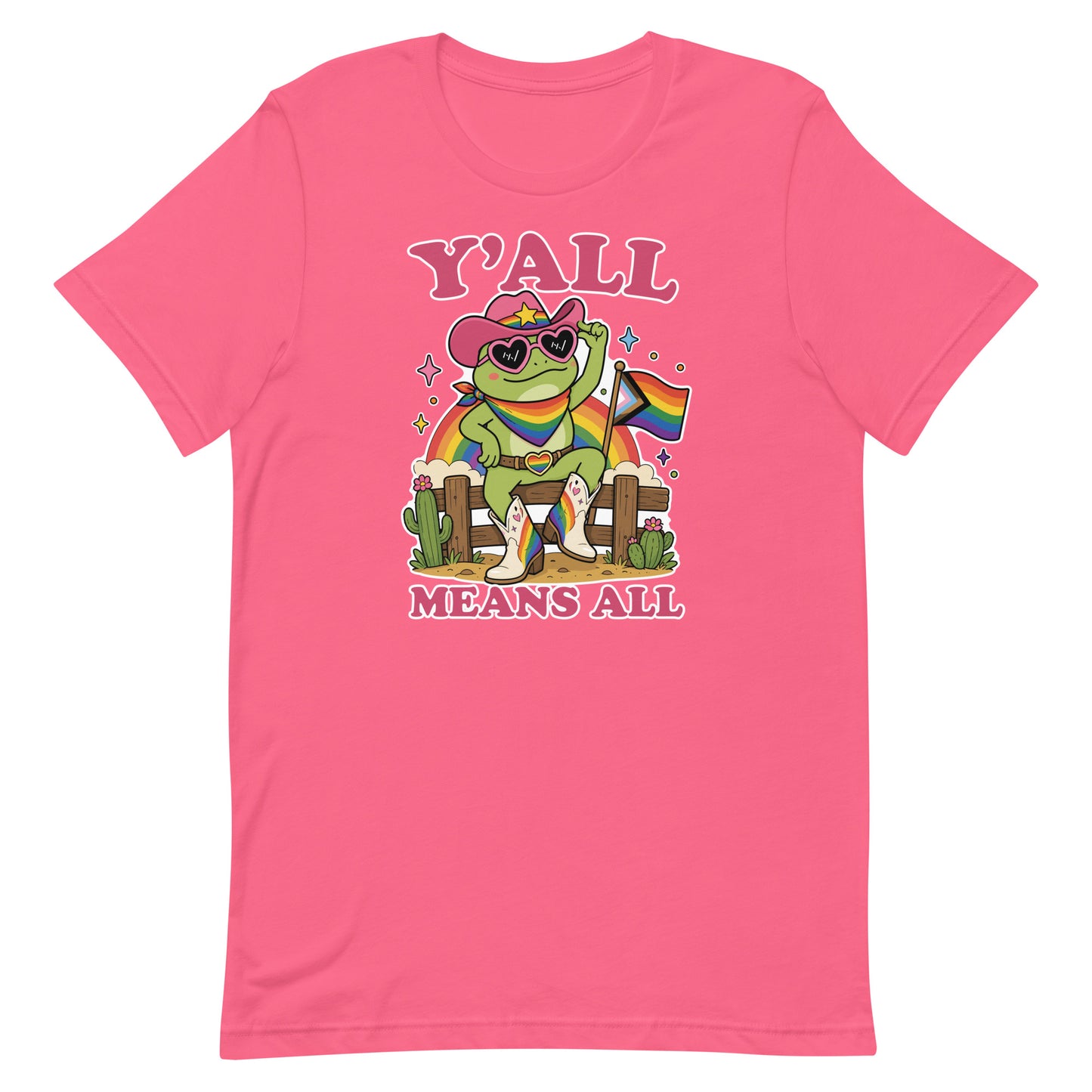 Pink unisex pride t-shirt featuring colorful cowboy frog artwork with rainbow flag accents and “Y’All Means All” message celebrating visibility and inclusion.