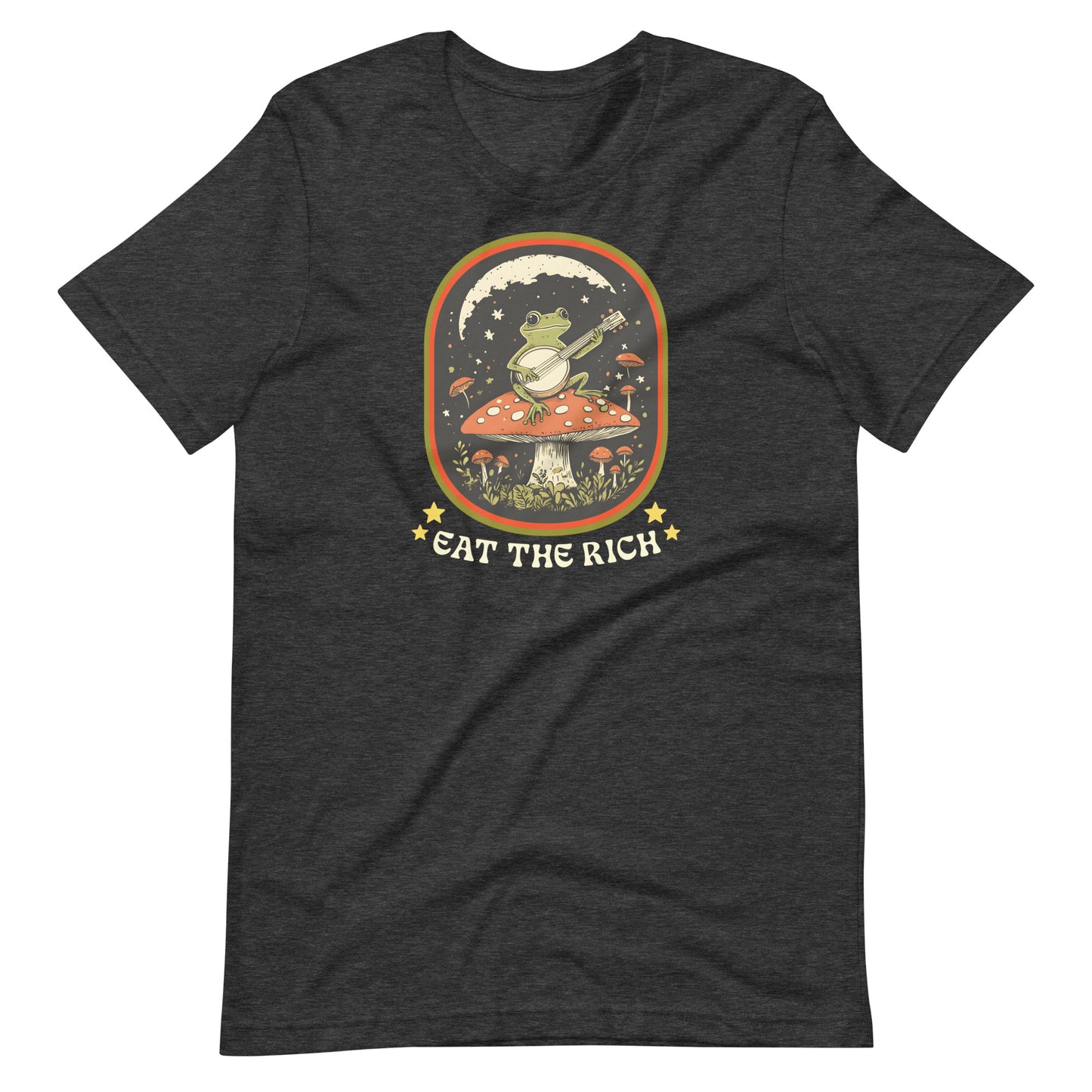 Dark heather t-shirt featuring retro folk-art frog artwork with banjo details, decorative stars, and “Eat The Rich” anti-capitalism message.