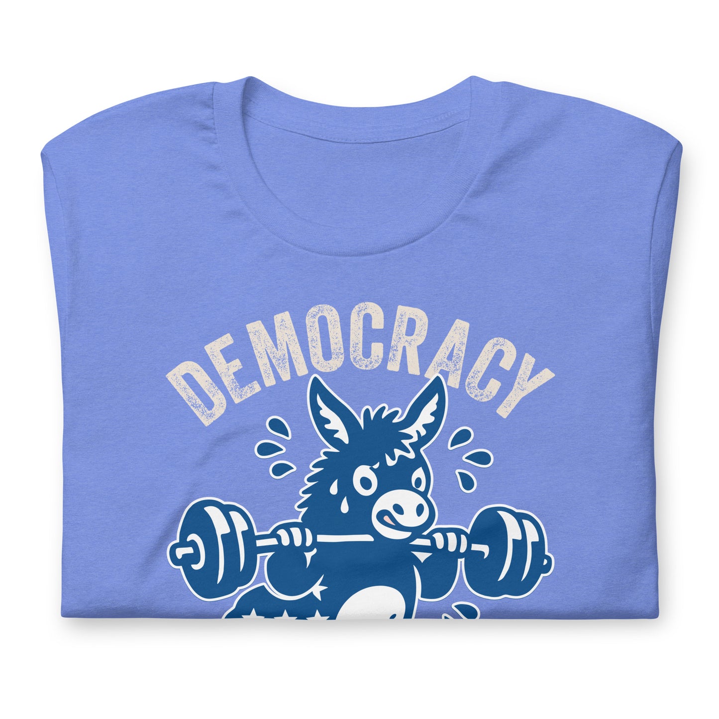 Folded heather blue unisex T-shirt displaying blue donkey illustration, barbell artwork, and democracy-themed fitness phrase in distressed athletic lettering.