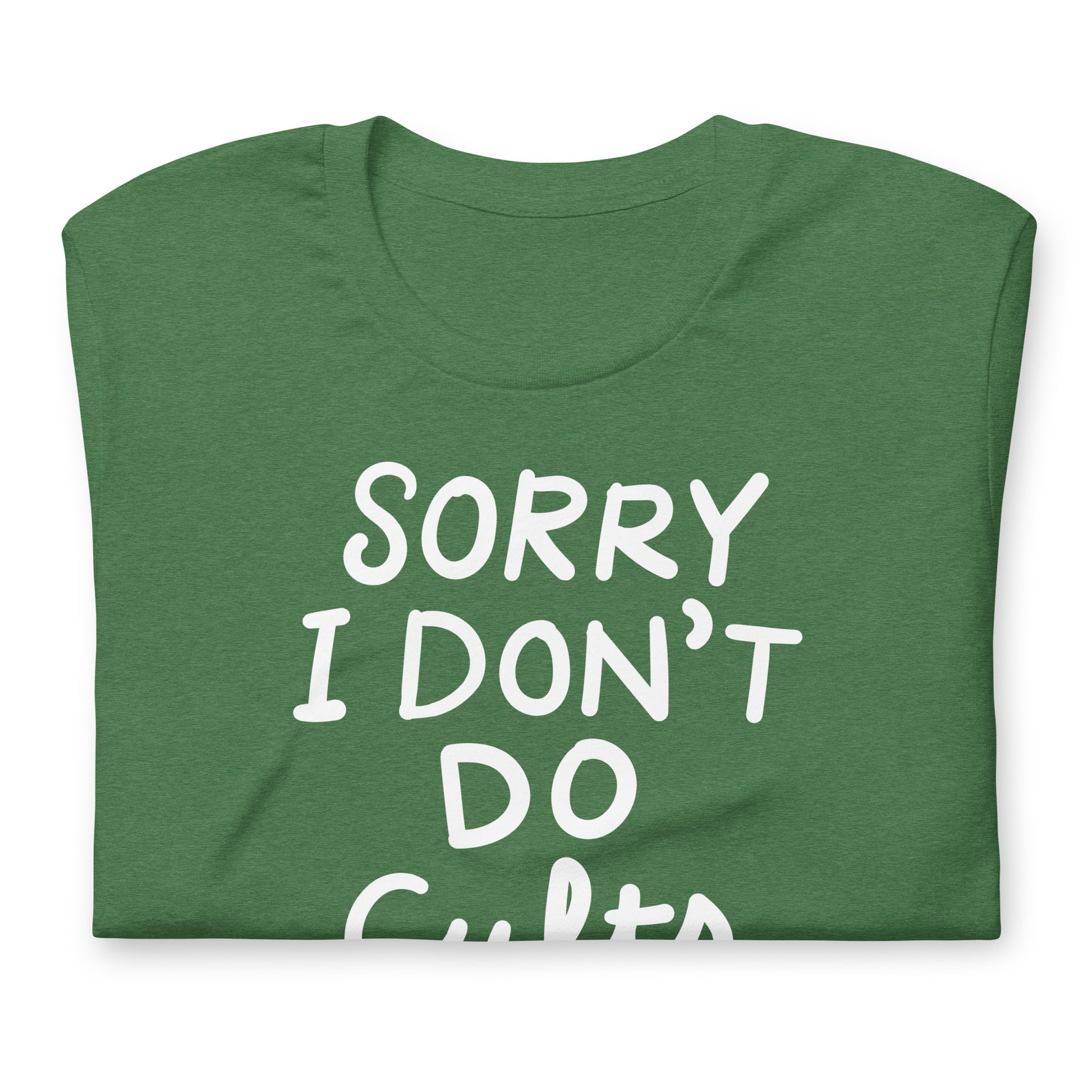 Folded heather green unisex t-shirt featuring white text “SORRY I DON’T DO CULTS.” with small red crossed-out MAGA hat graphic.