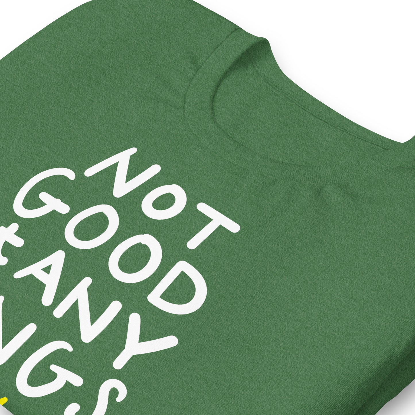 Close view of heather green t-shirt fabric showing hand-drawn text “NOT GOOD AT ANY KINGS” and crossed crown illustration.