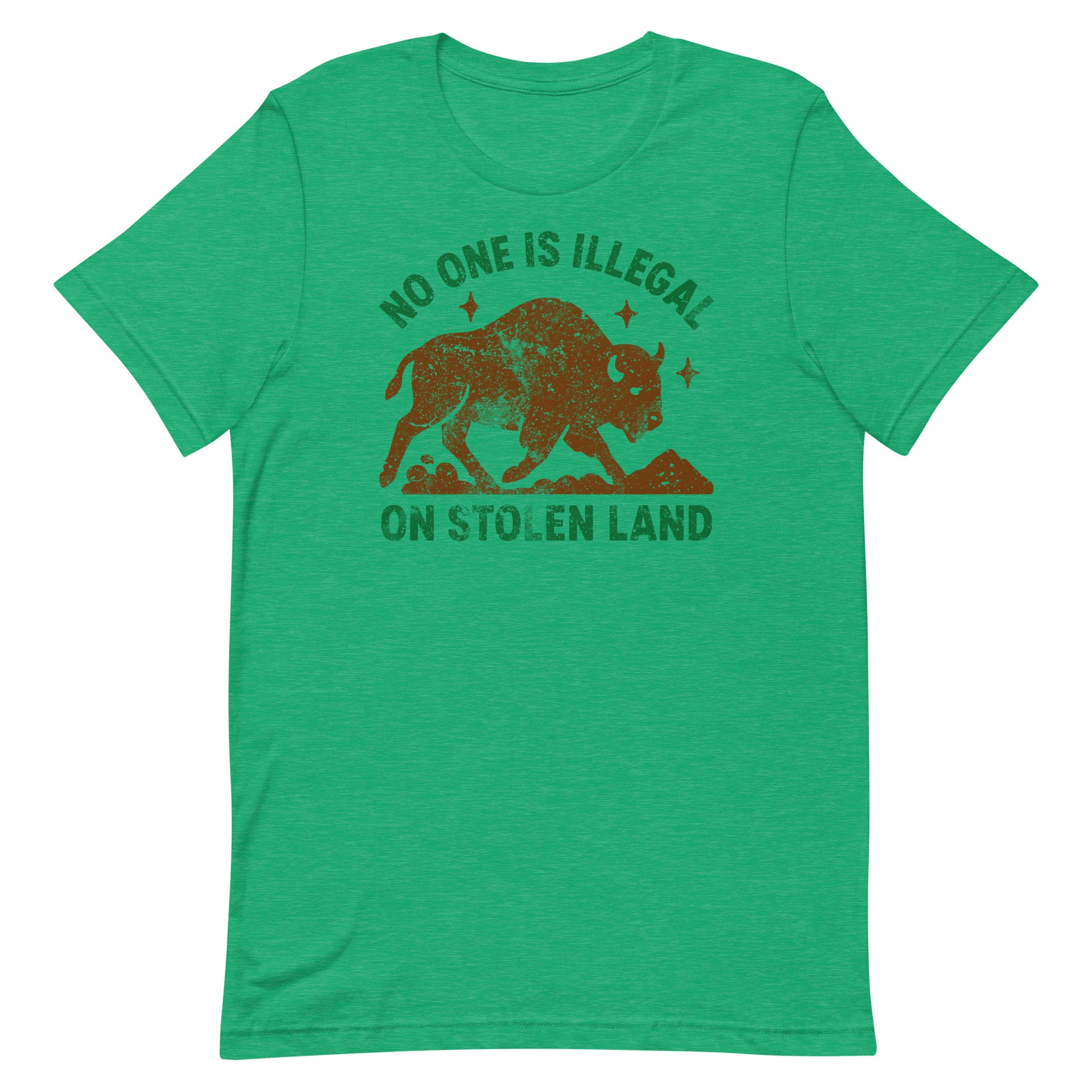 Heather green unisex t-shirt featuring the buffalo graphic and “NO ONE IS ILLEGAL ON STOLEN LAND,” designed with earthy tones contrasting the cool fabric color.