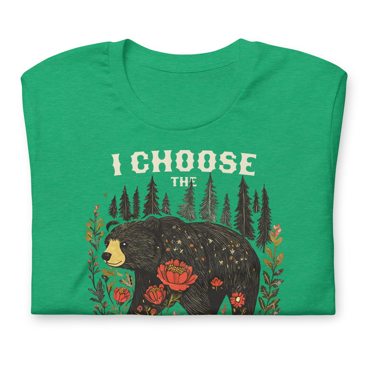 Folded heather green unisex t-shirt featuring illustrated bear surrounded by flowers and trees with phrase “I Choose The Bear,” equality-focused design.