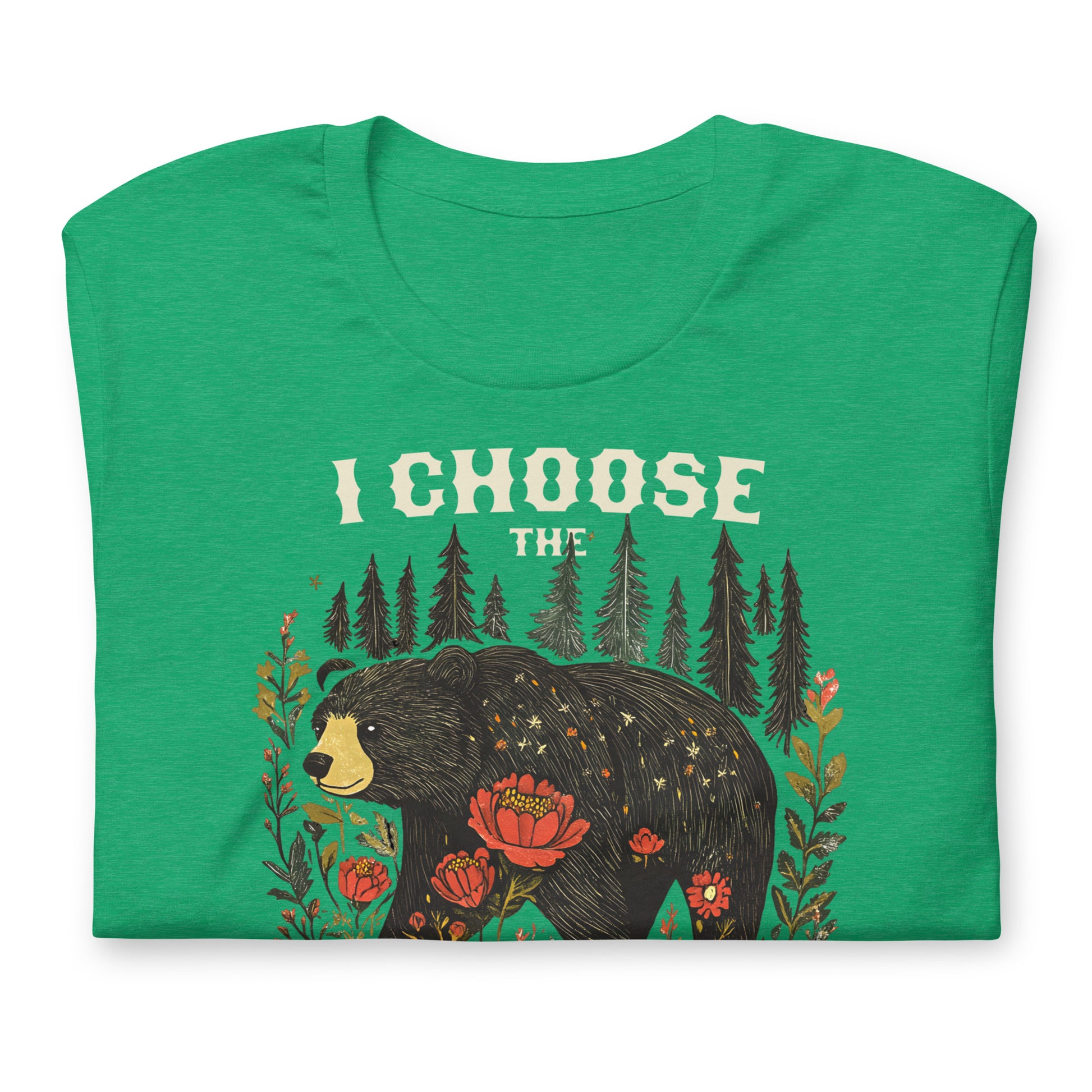 Folded heather green unisex t-shirt featuring illustrated bear surrounded by flowers and trees with phrase “I Choose The Bear,” equality-focused design.