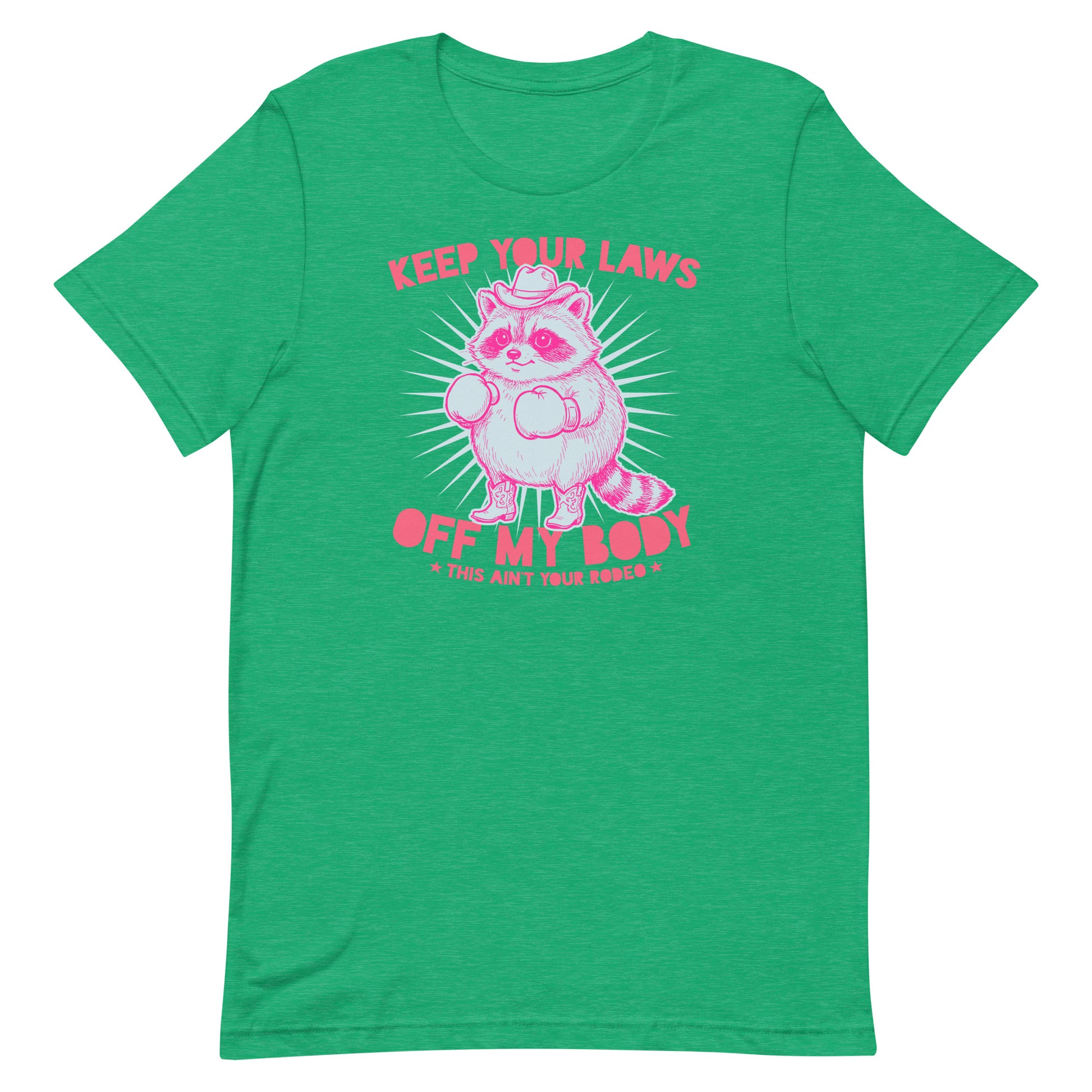 Bright heather kelly green unisex tee featuring cowboy raccoon artwork and “Keep Your Laws Off My Body” message in bold feminist protest design.