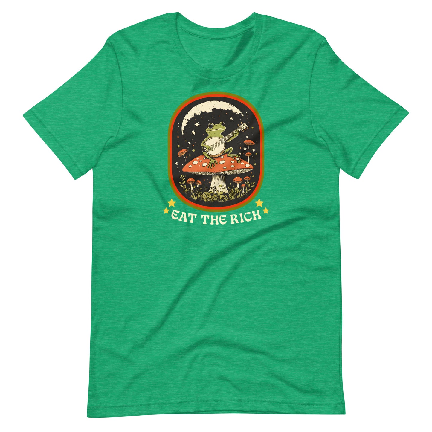 Heather Kelly green protest t-shirt featuring whimsical frog musician artwork framed in a retro-style design with bold “Eat The Rich” lettering.