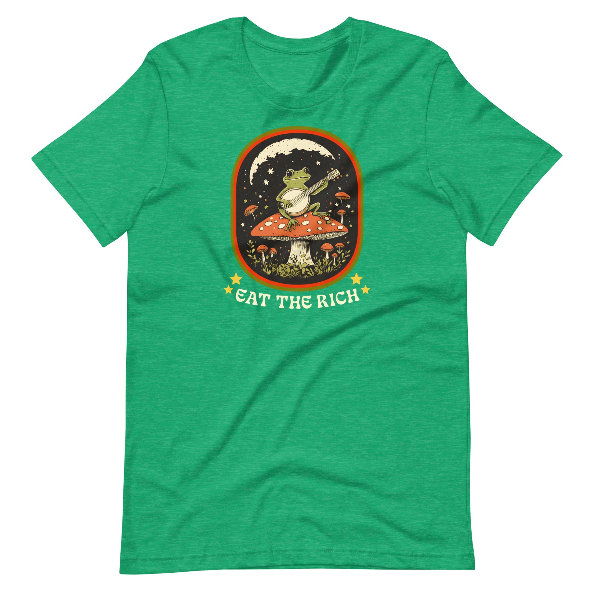 Heather Kelly green protest t-shirt featuring whimsical frog musician artwork framed in a retro-style design with bold “Eat The Rich” lettering.
