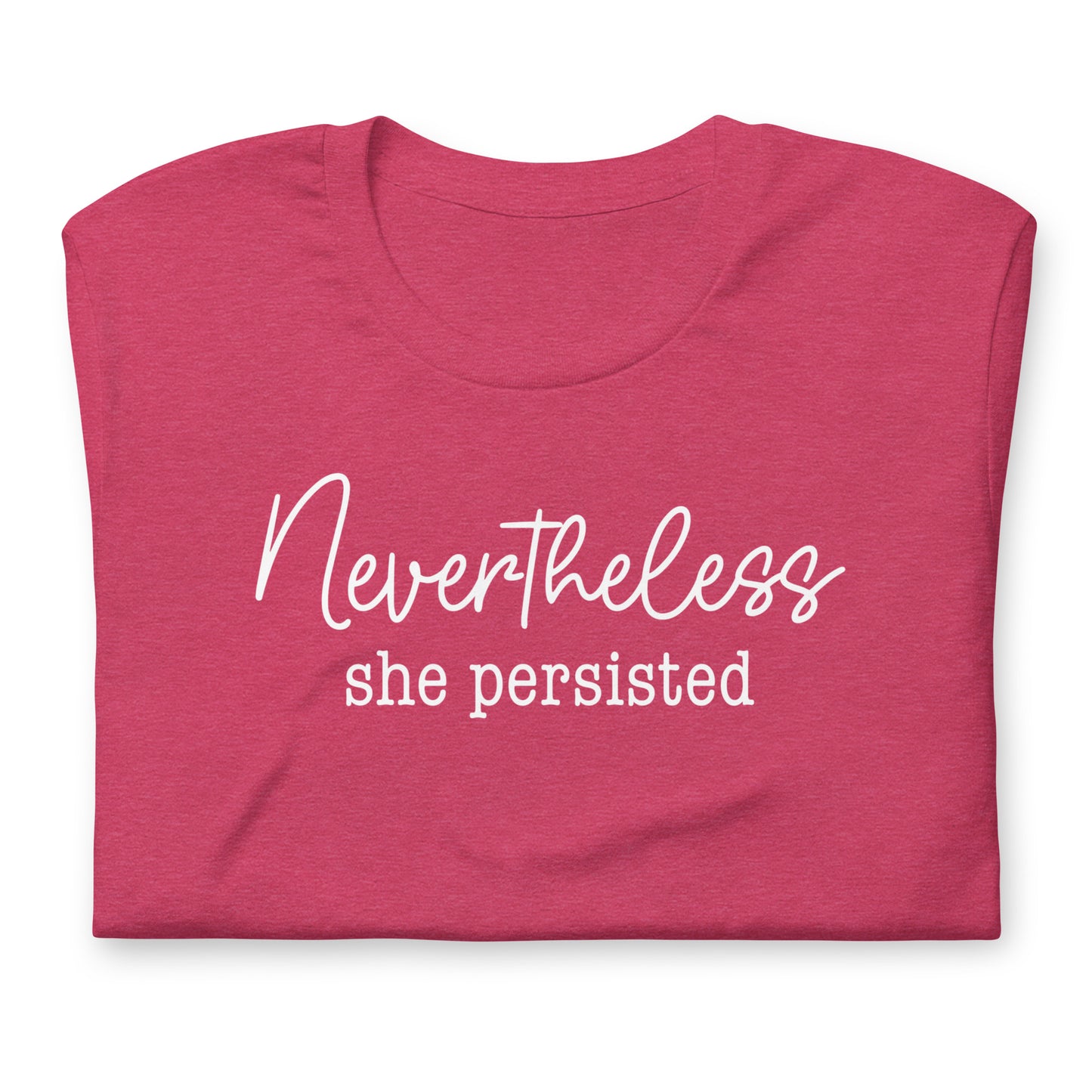 Folded heather pink unisex t-shirt featuring elegant script typography reading “Nevertheless she persisted,” women’s rights activist apparel.