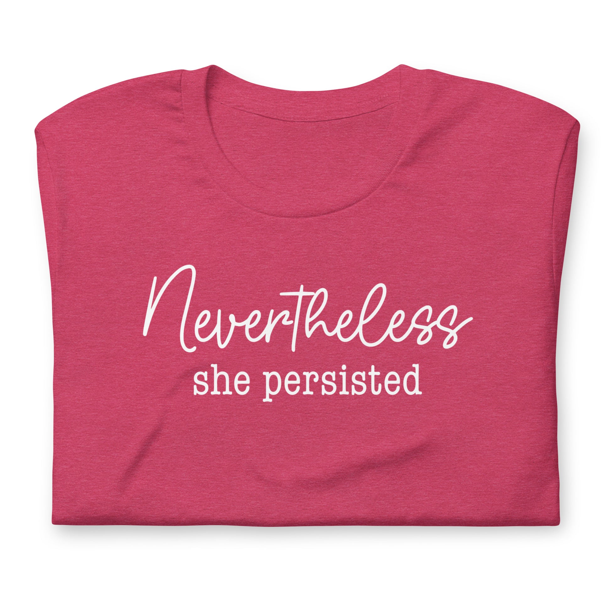 Folded heather pink unisex t-shirt featuring elegant script typography reading “Nevertheless she persisted,” women’s rights activist apparel.