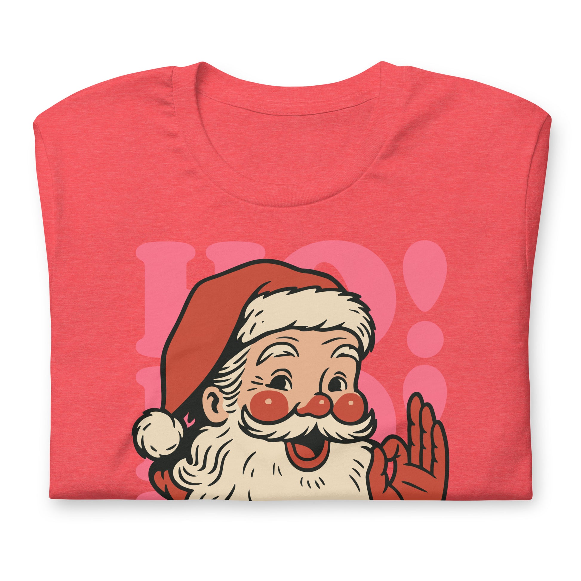 Detailed close-up of the coral-colored “HO! HO! HO!” Santa design printed on a folded holiday t-shirt.