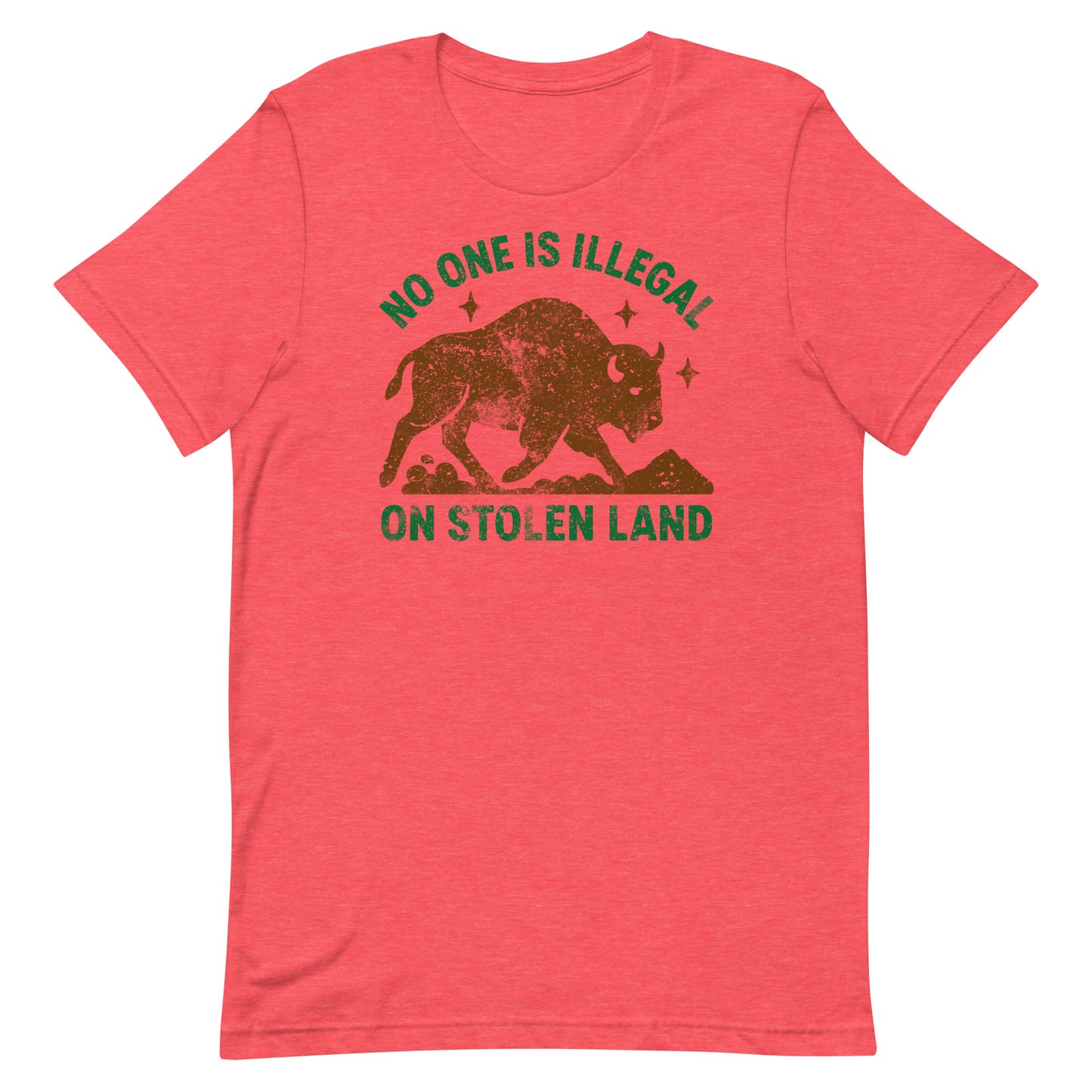 Red heather tee with distressed buffalo artwork and the text “NO ONE IS ILLEGAL ON STOLEN LAND,” offering a warm-toned take on Indigenous rights messaging.