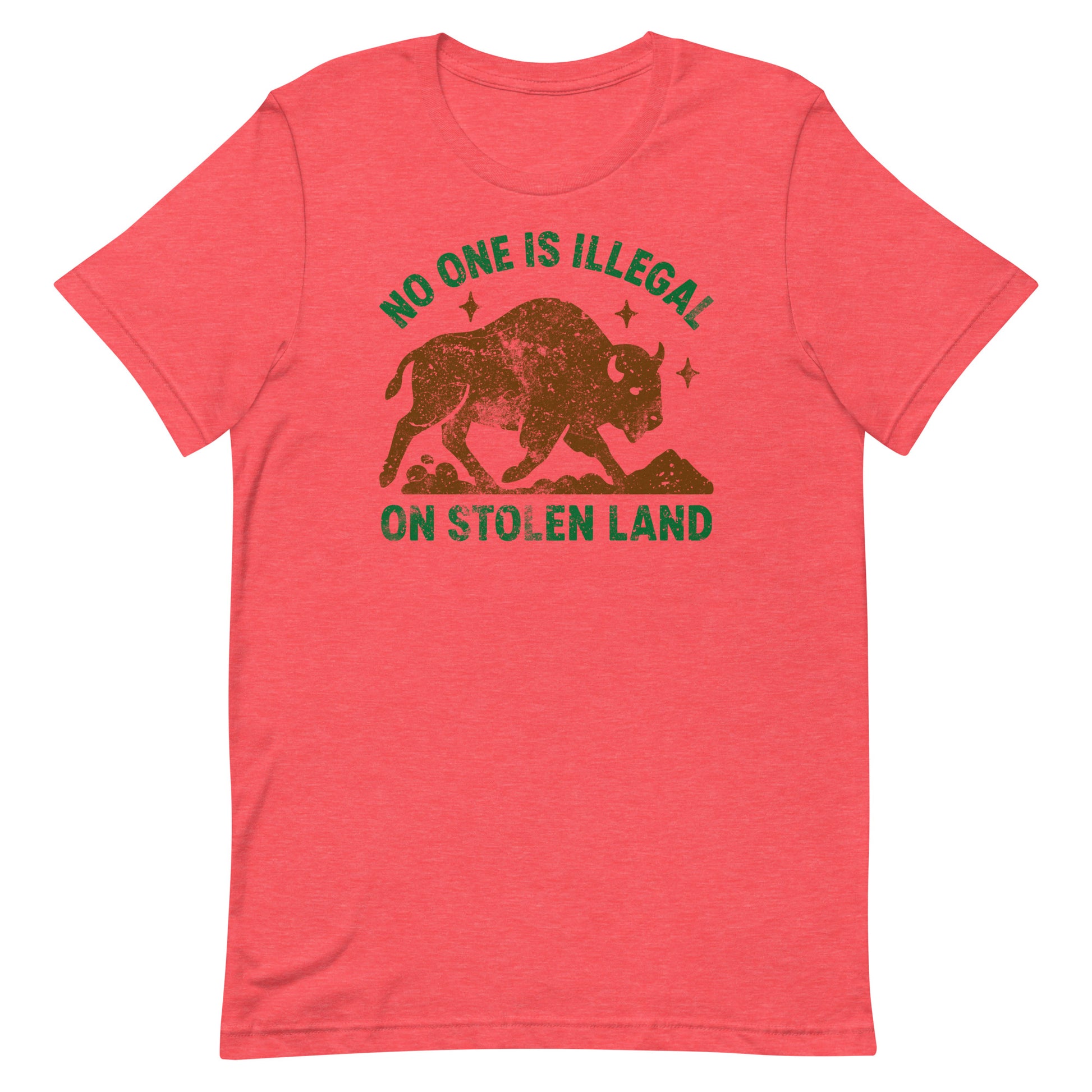 Red heather tee with distressed buffalo artwork and the text “NO ONE IS ILLEGAL ON STOLEN LAND,” offering a warm-toned take on Indigenous rights messaging.