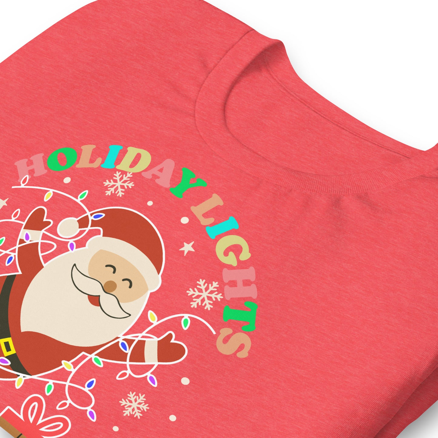 Close-up of a heather red t-shirt showing Santa, wrapped gifts, and holiday lights with the message “HOLIDAY LIGHTS ABOLISH ICE,” designed by Blue Wave USA.