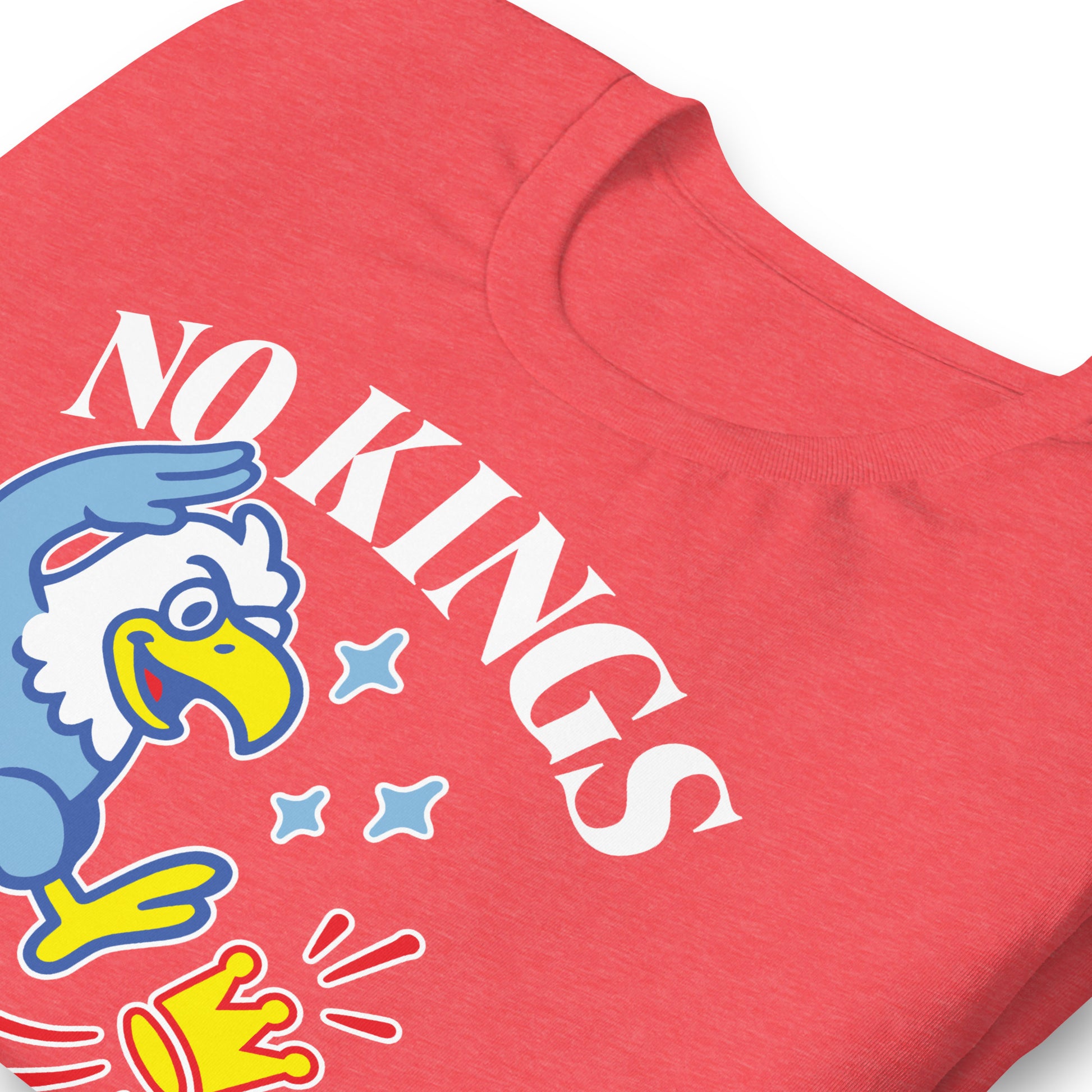 Close-up of heather red t-shirt artwork featuring eagle, crown symbol, and “NO KINGS IN AMERICA SINCE 1776.”
