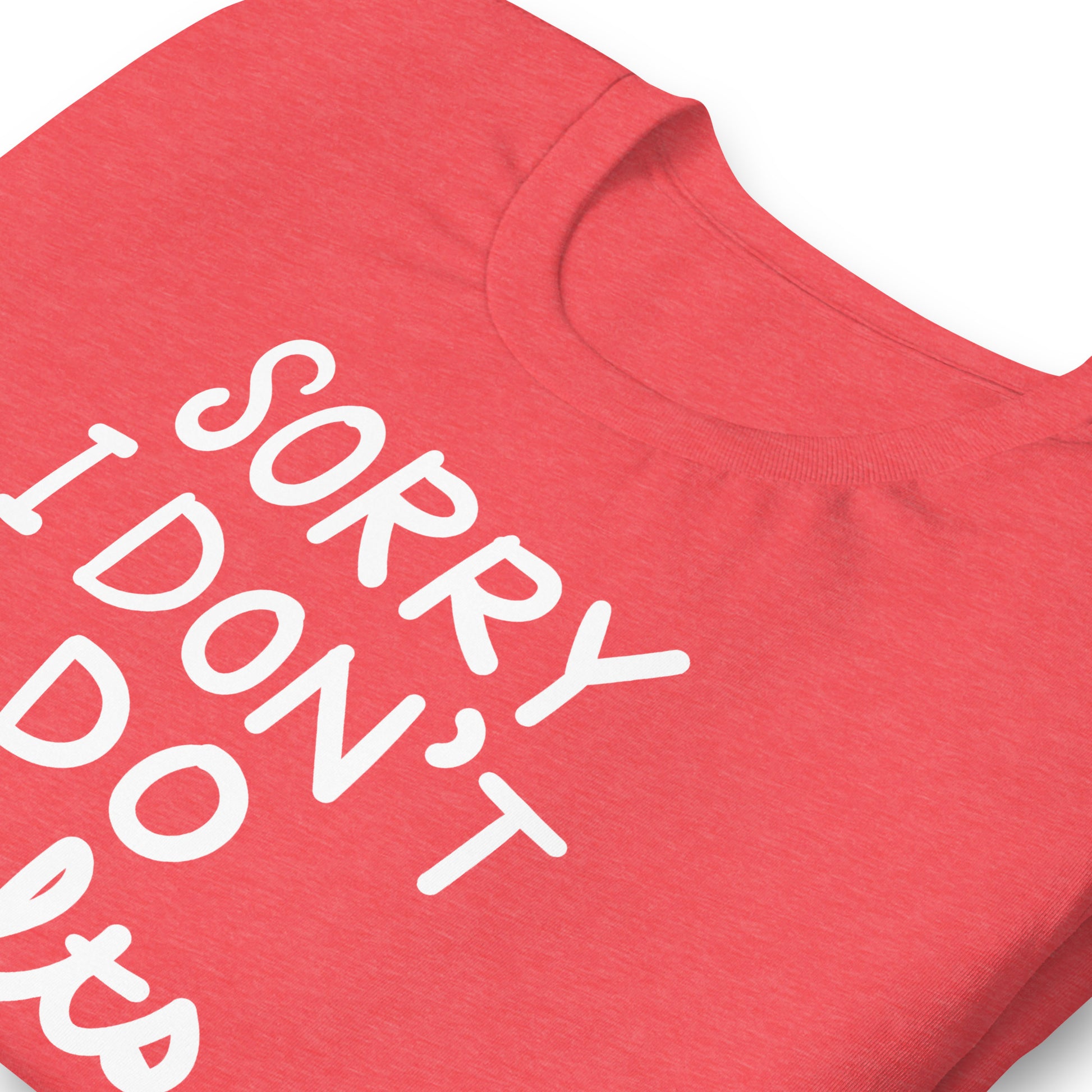 Close view of heather red t-shirt artwork showing the phrase “SORRY I DON’T DO CULTS.” and crossed-out MAGA hat symbol.