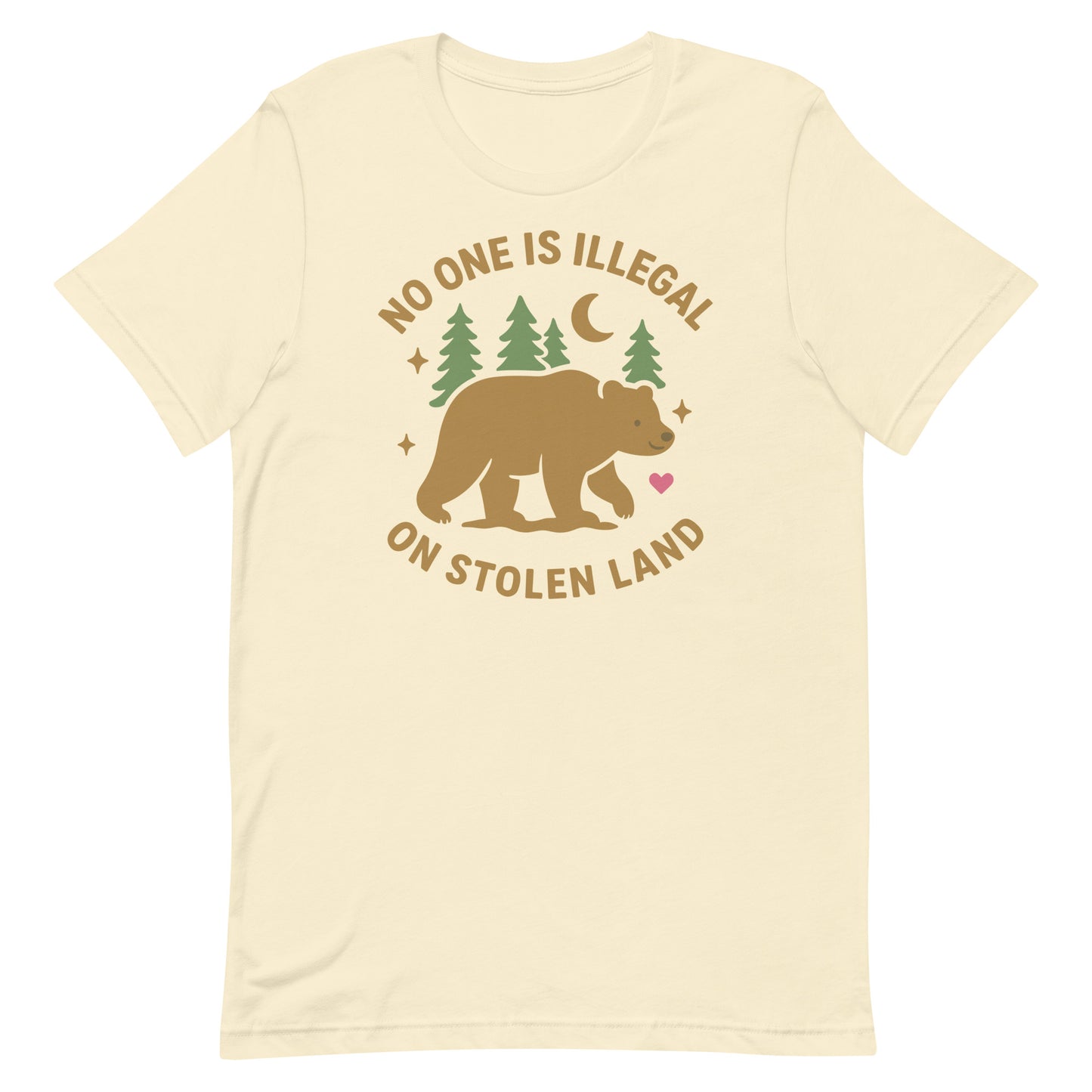 Cream unisex t-shirt featuring the bear, pine trees, and moon illustration along with the message “NO ONE IS ILLEGAL ON STOLEN LAND,” using warm, earthy print tones.