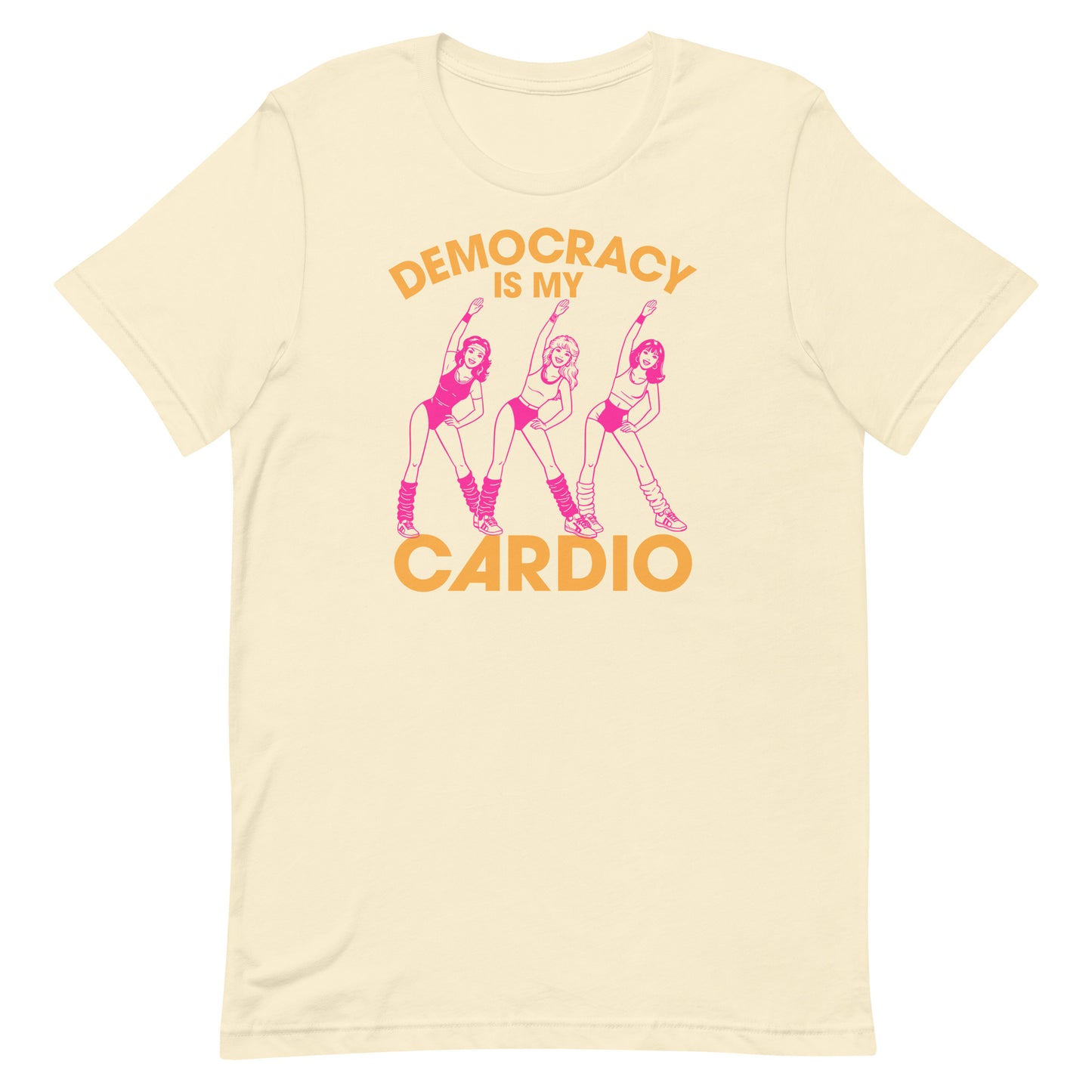 Cream unisex T-shirt showing pink retro fitness dancers with democracy workout message, soft vintage colorway for progressive apparel styling.