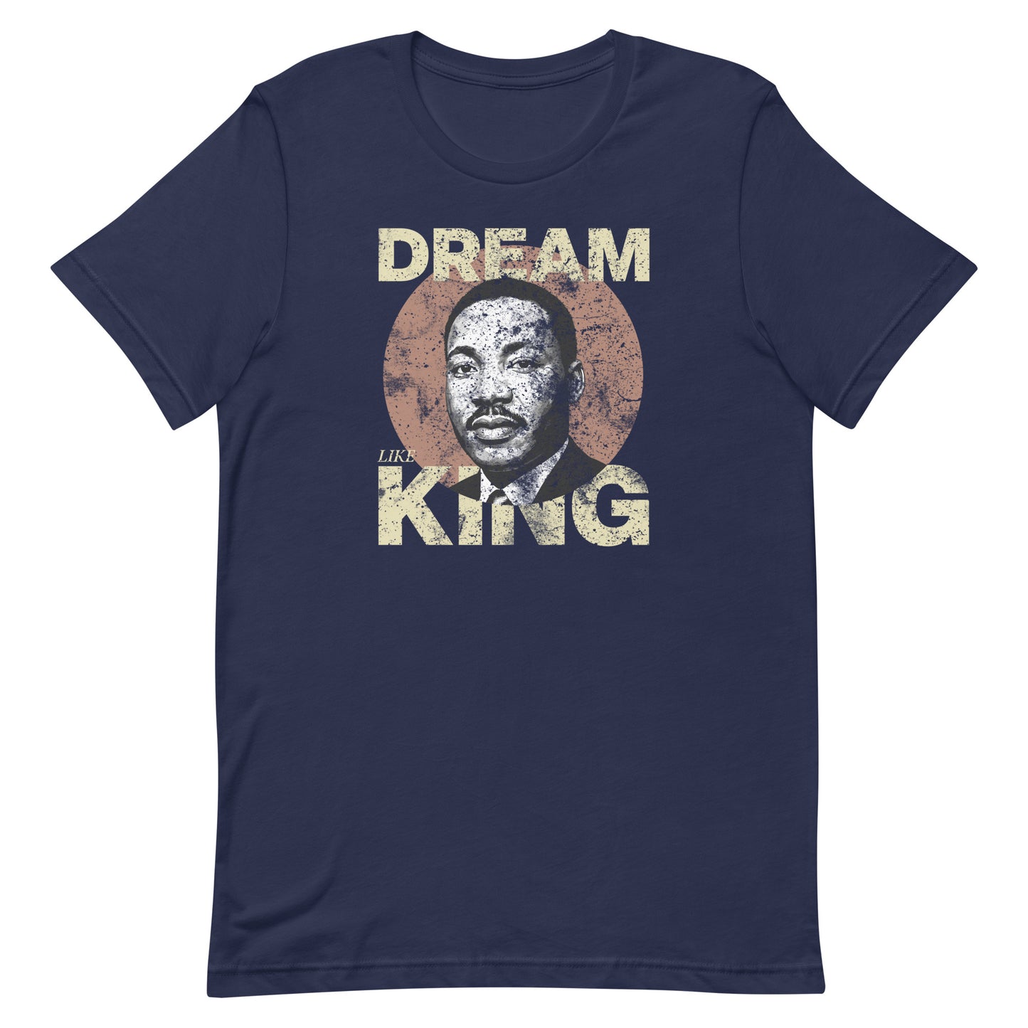Navy unisex t-shirt with the “DREAM LIKE KING” graphic showing MLK’s portrait inside a textured circle. Retro civil-rights message from Blue Wave USA.