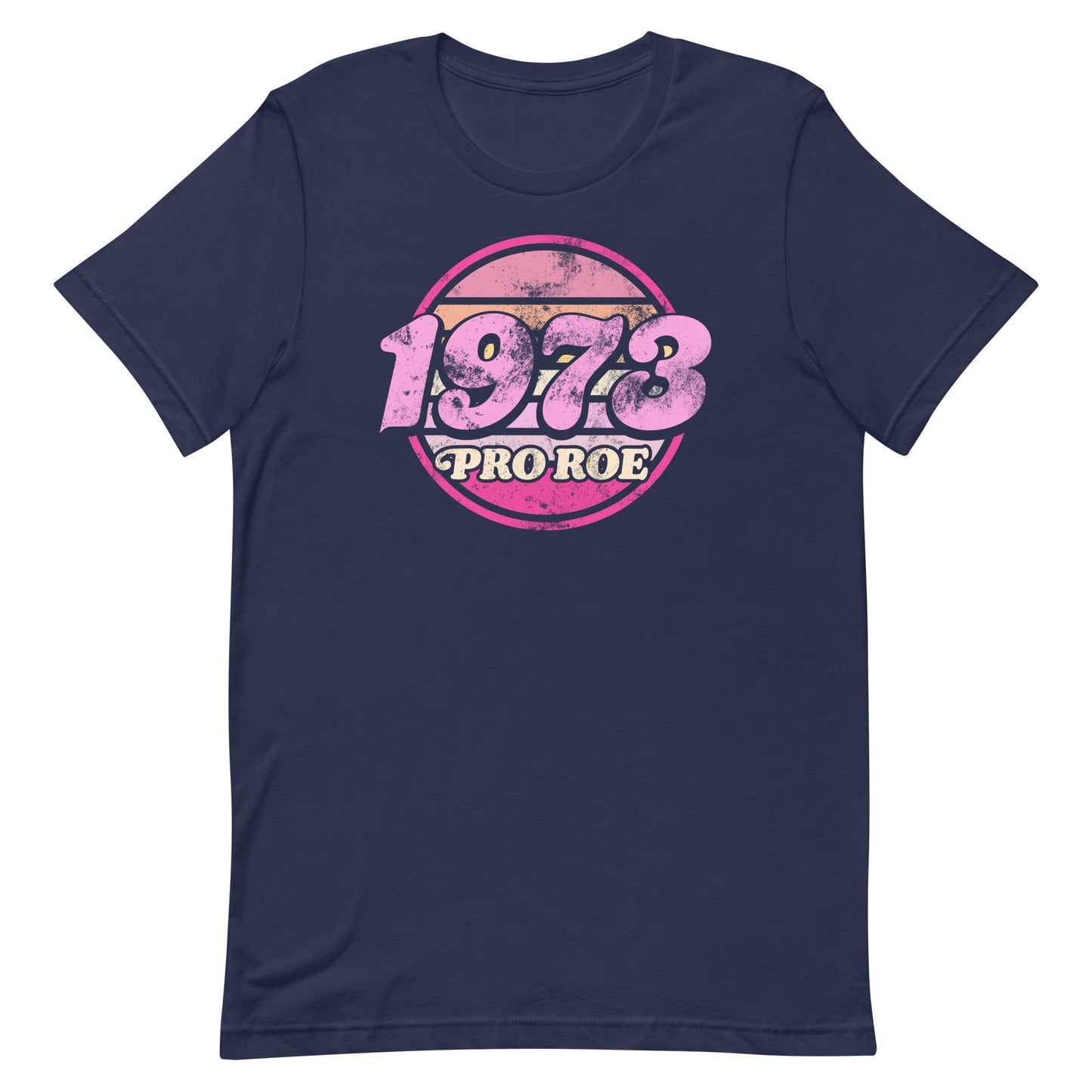 Navy unisex t-shirt shown flat, displaying a retro pink circular badge reading “1973 PRO ROE,” centered vintage reproductive freedom design by Blue Wave USA.