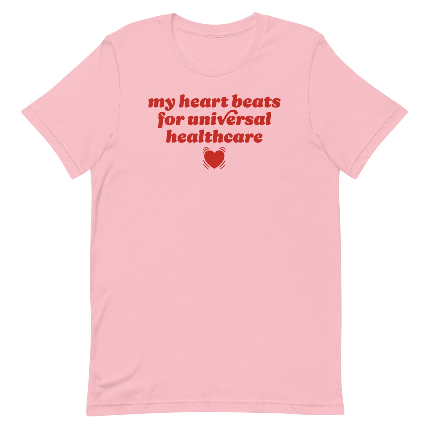 Pink unisex t-shirt featuring red typography reading “my heart beats for universal healthcare,” a progressive Valentine design supporting healthcare access and people-first policy values.